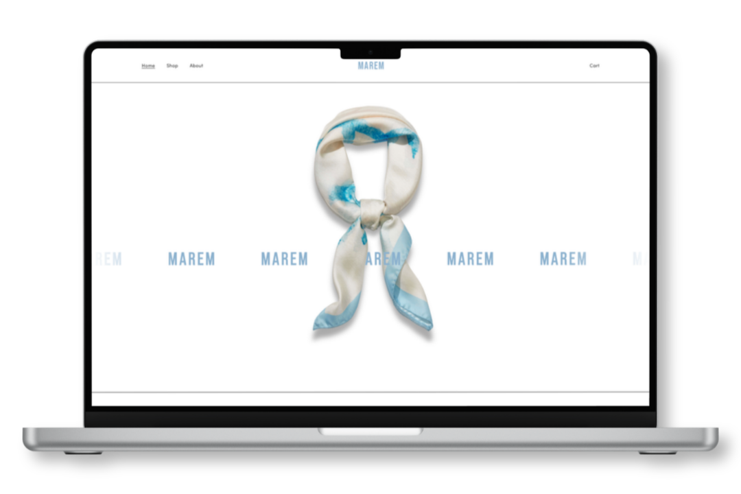 Computer mockup showing ecommerce website design for Marem Scarves luxury scarf retail brand