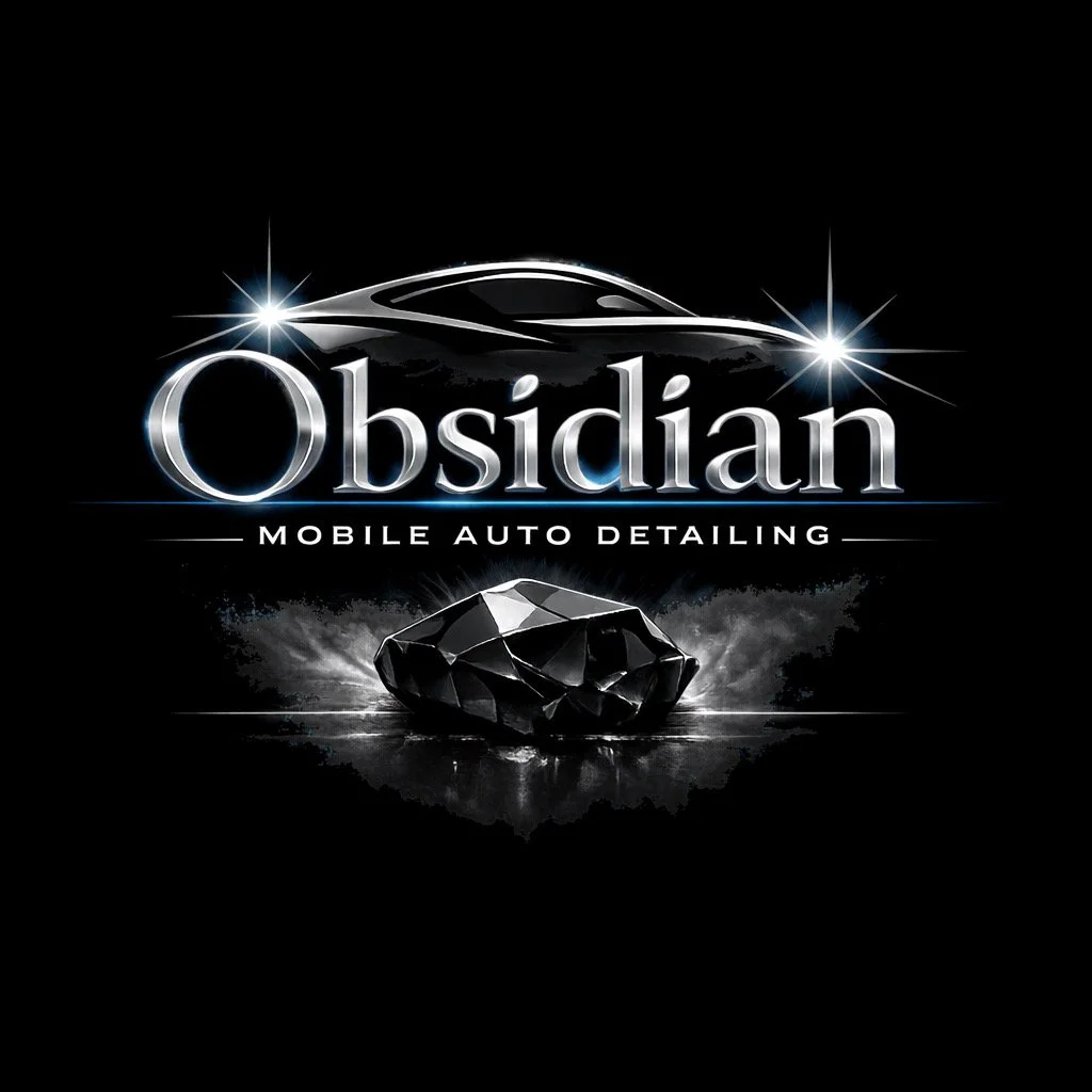 Black background with a shiny black diamond and a sleek car silhouette above. Text reads 'Obsidian Mobile Auto Detailing' with the word 'Obsidian' in large, metallic font. The overall design has a luxurious and high-end feel.