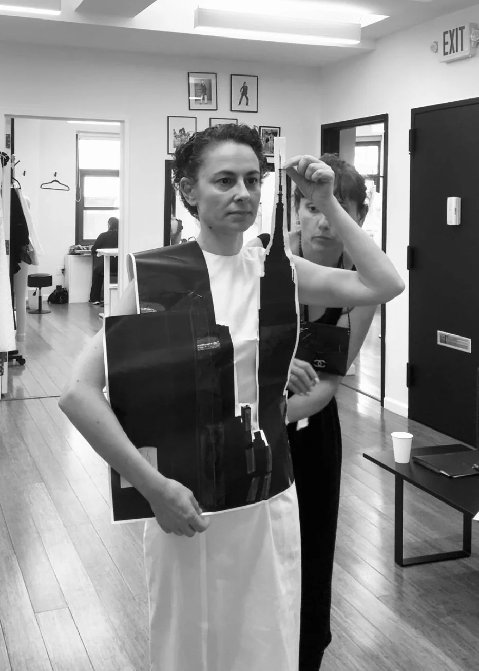 Nicky Conti with Estelle Chatorrier testing a paper prototype of the Empeiria garment during early development