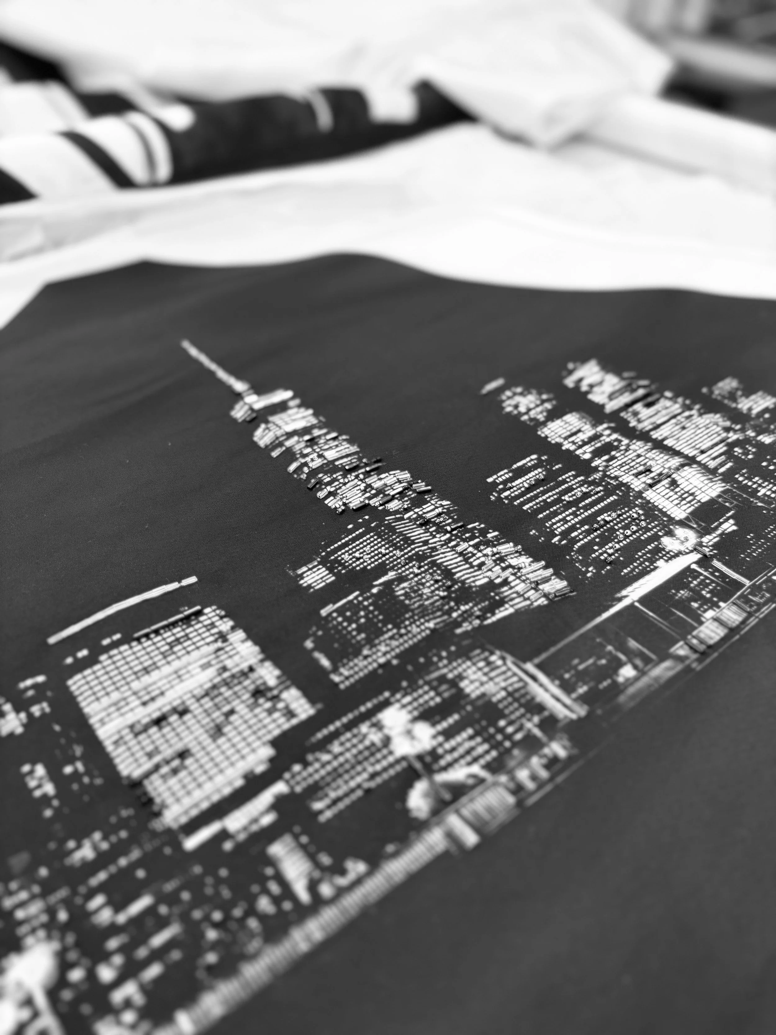 Close-up of the Dazziliance top embroidery showing beadwork before it is assembled onto the garment structure