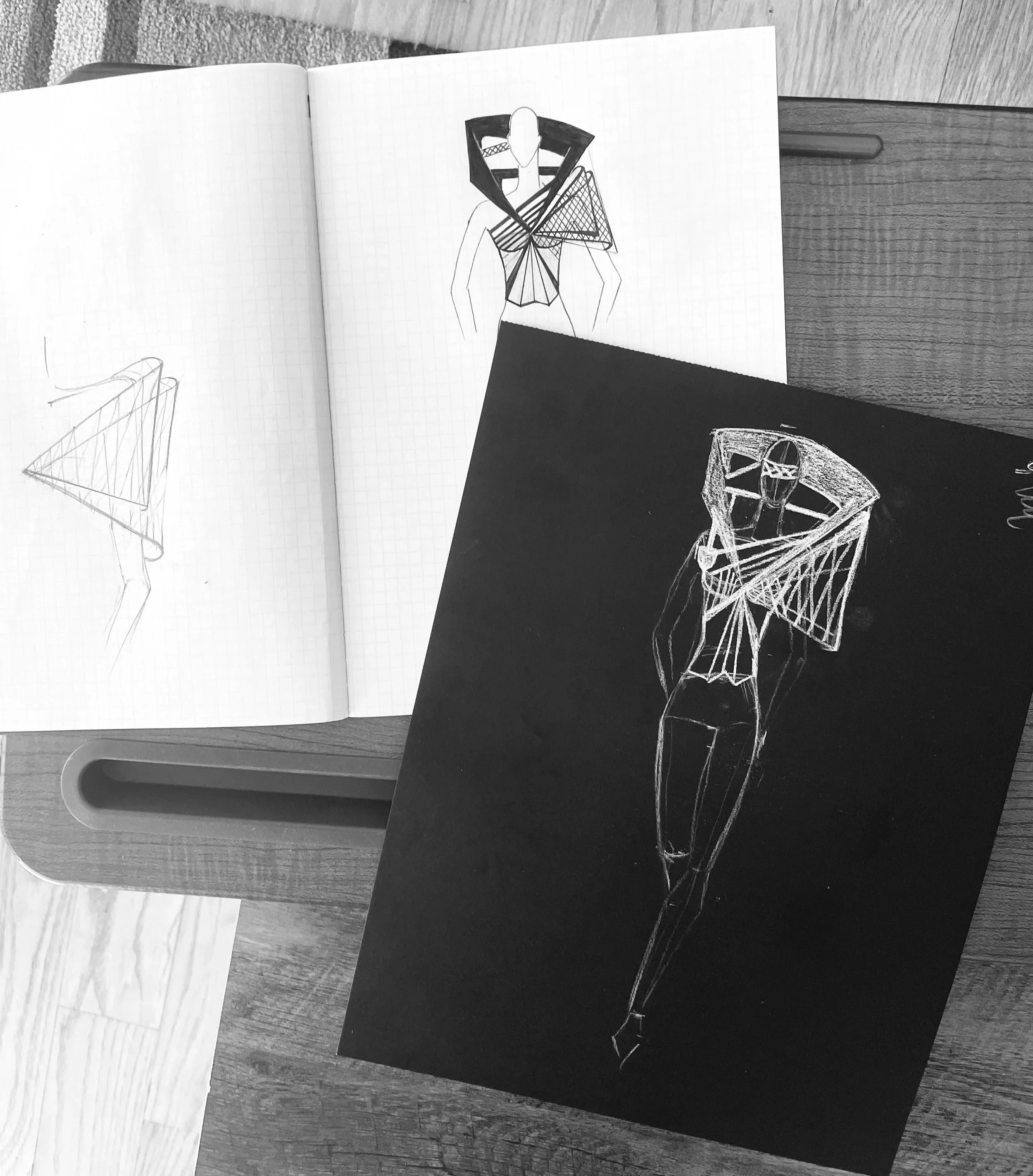 Sketches of the Ironick outfit, showing abstracted lines and structural forms inspired by a photograph of the Williamsburg Bridge, translating architecture into garment design.