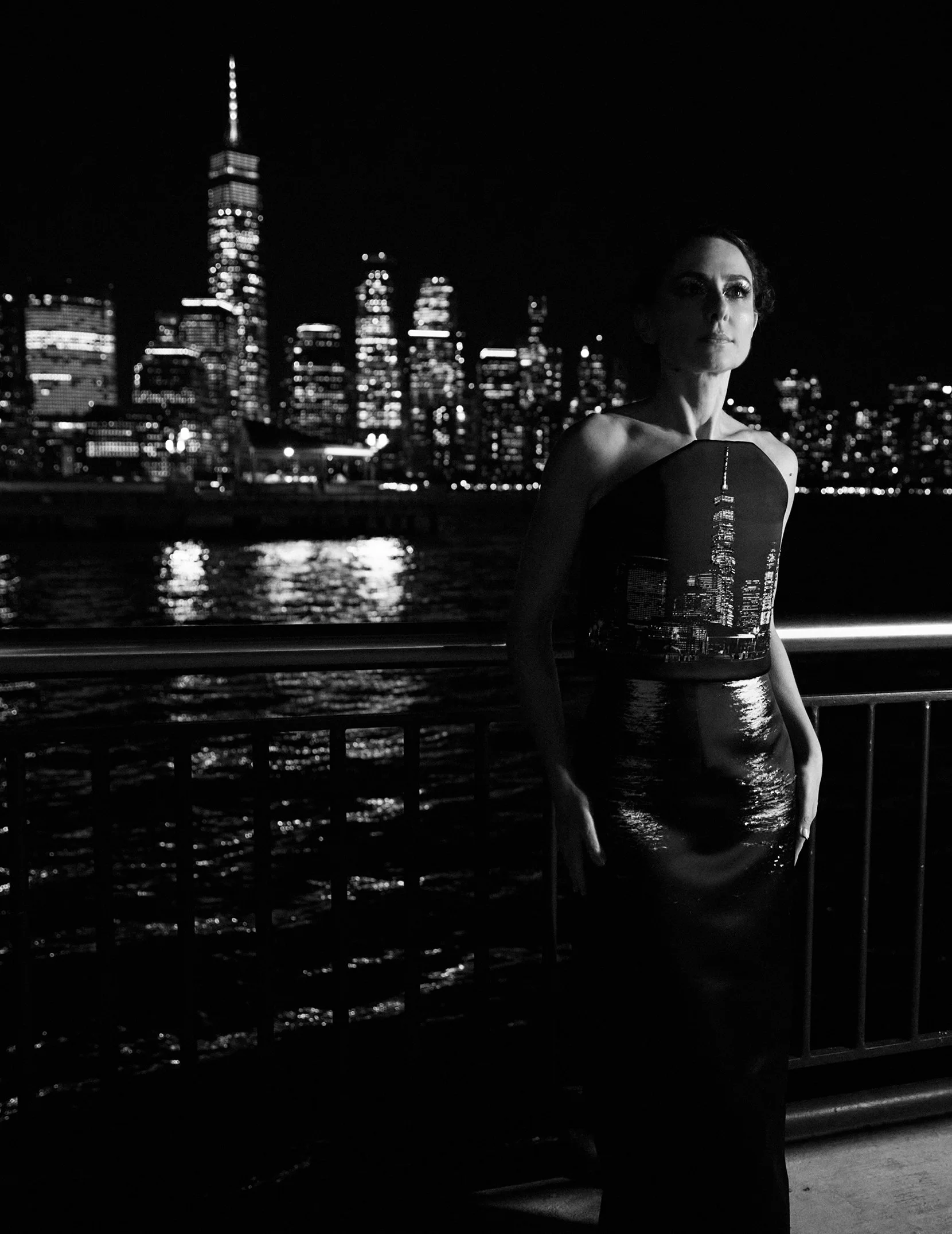 Nicky Conti wearing the Dazziliance couture look featuring a skyline and water reflection print, photographed in New York City