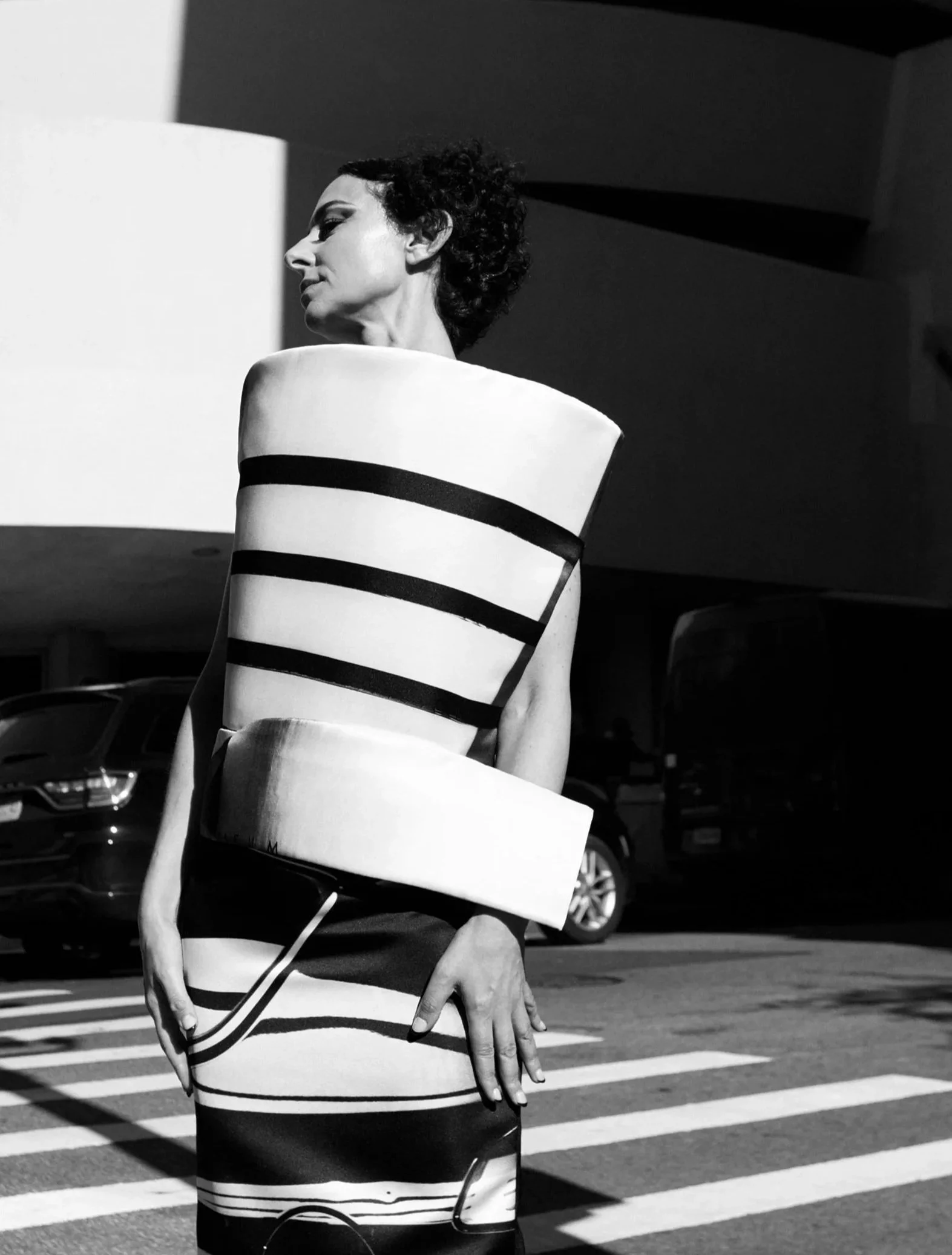 Nicky Conti wearing a sculptural black and white couture look inspired by the Guggenheim Museum, photographed on location in New York City