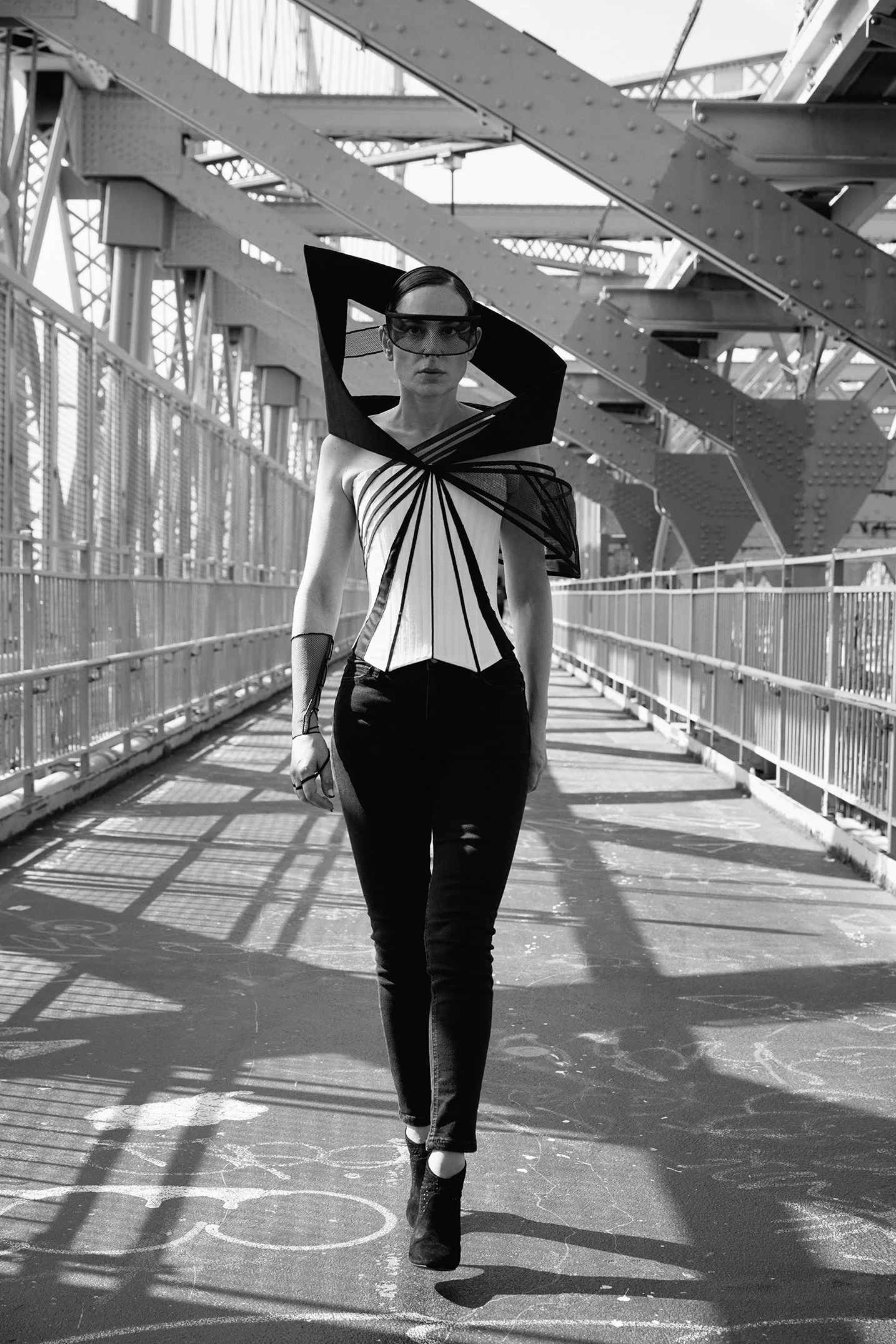 Nicky Conti wearing the Ironick couture look within on the Williamsburg Bridge, photographed in New York City