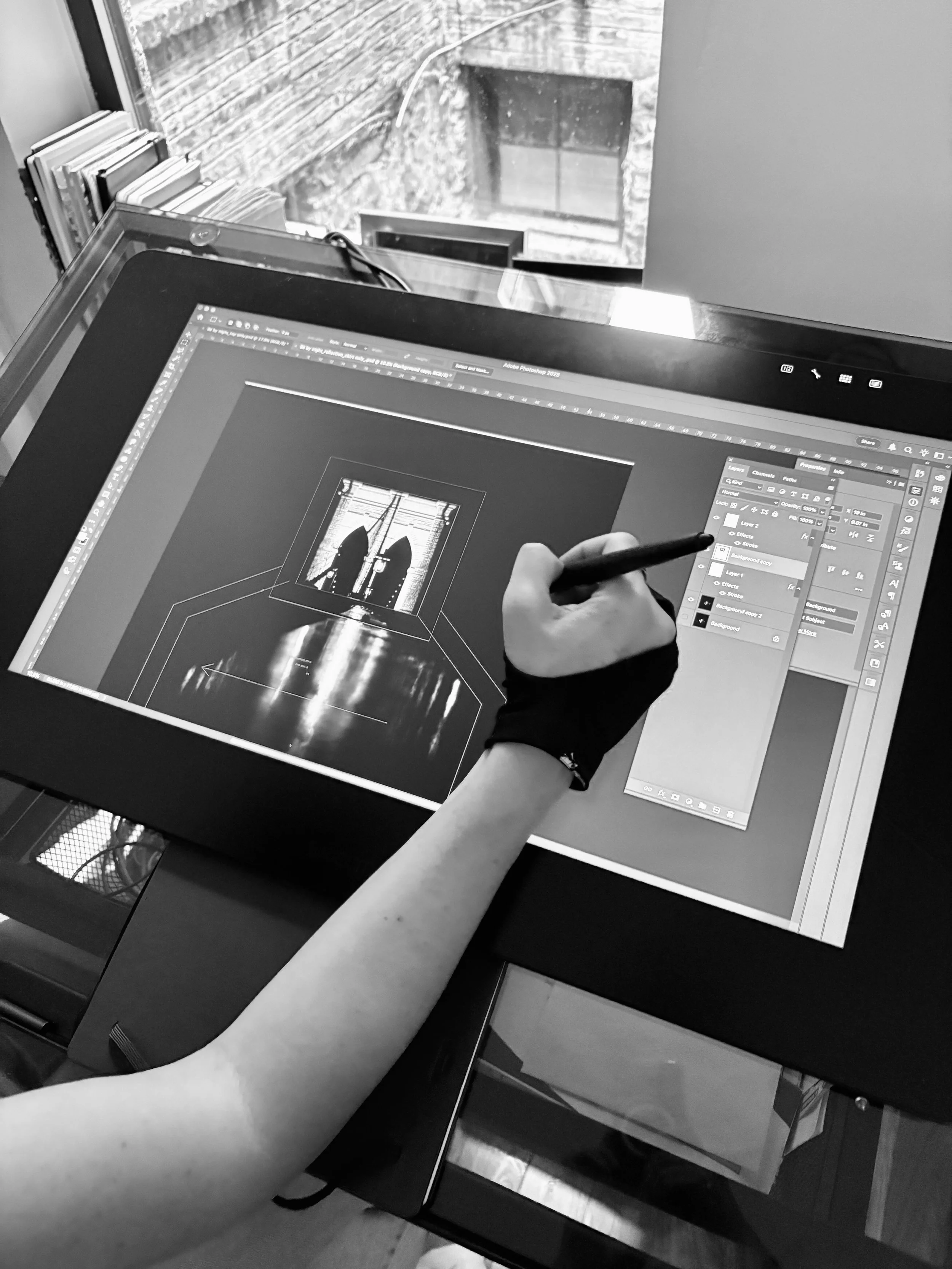 Sarah Esmoingt aligning photo of Brooklyn Bridge to digital pattern by dressmaker Estelle Chatorrier