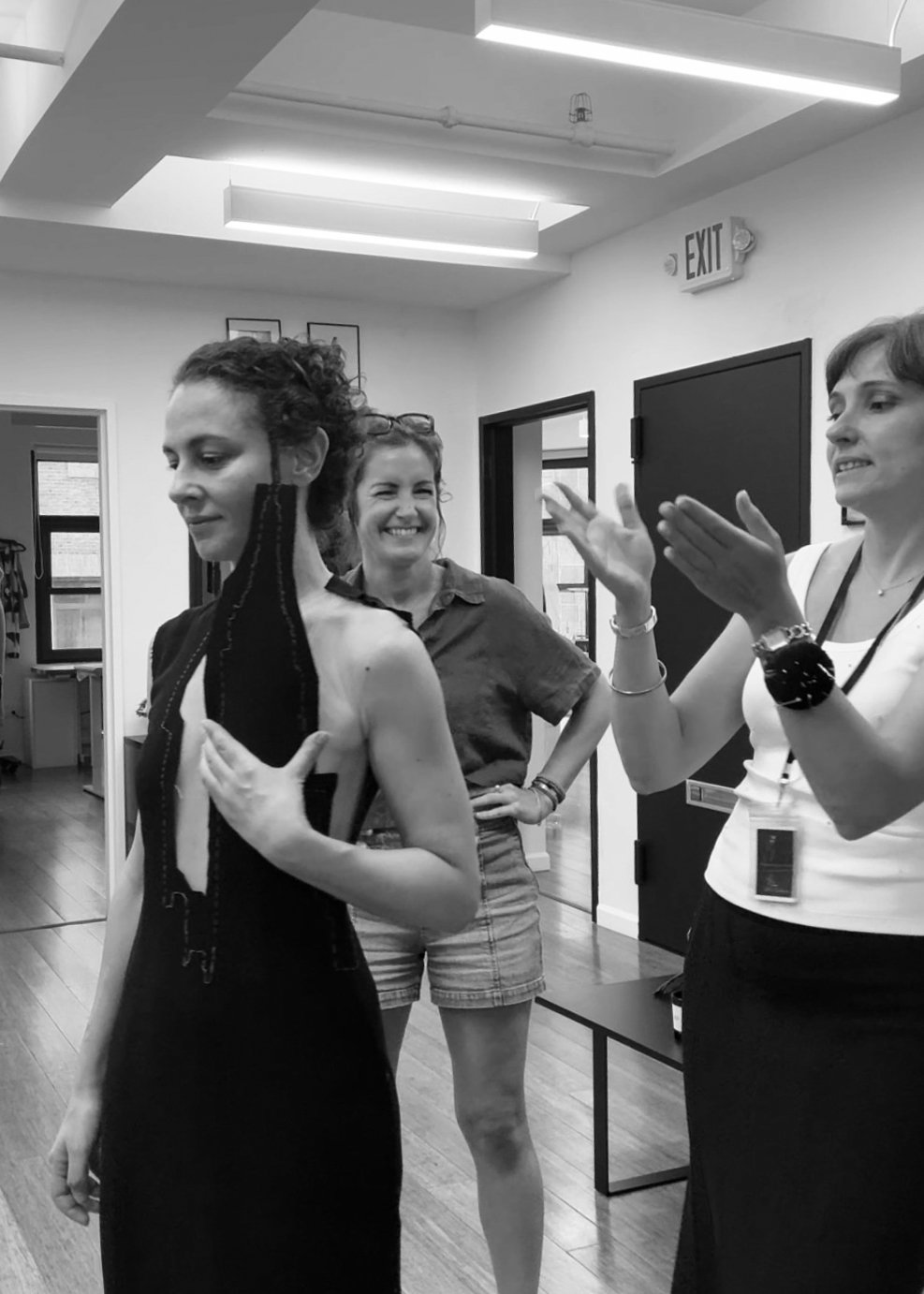 Nicky Conti with Sarah Esmoingt and Estelle Chatorrier during a fitting, all smiles as the Empeiria garment nears completion