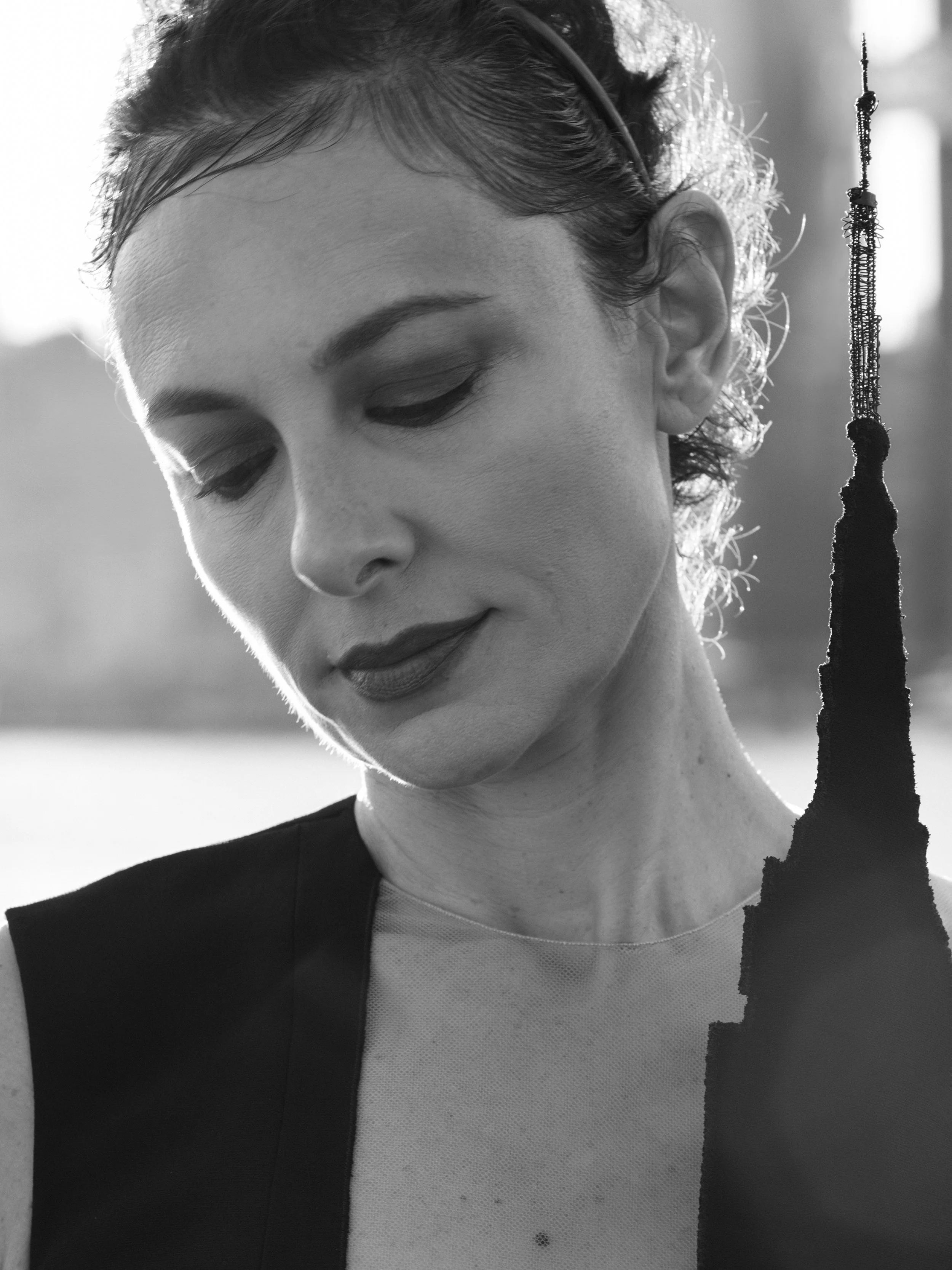 Close-up of Nicky Conti wearing the Empeiria custom couture dress, highlighting the hand-embroidered spire detail inspired by the Empire State Building