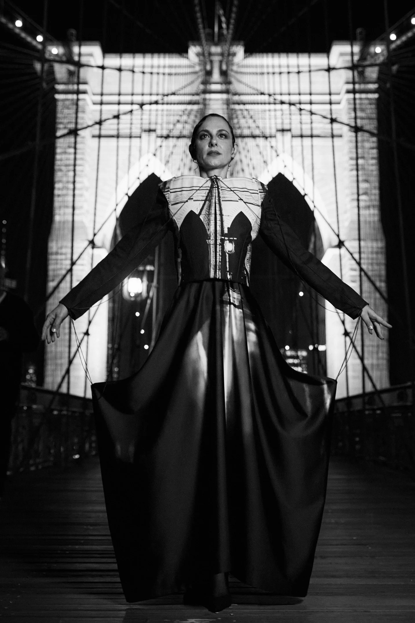 Nicky Conti wearing the Robe-ling couture look inspired by the Brooklyn Bridge, photographed on location in New York City