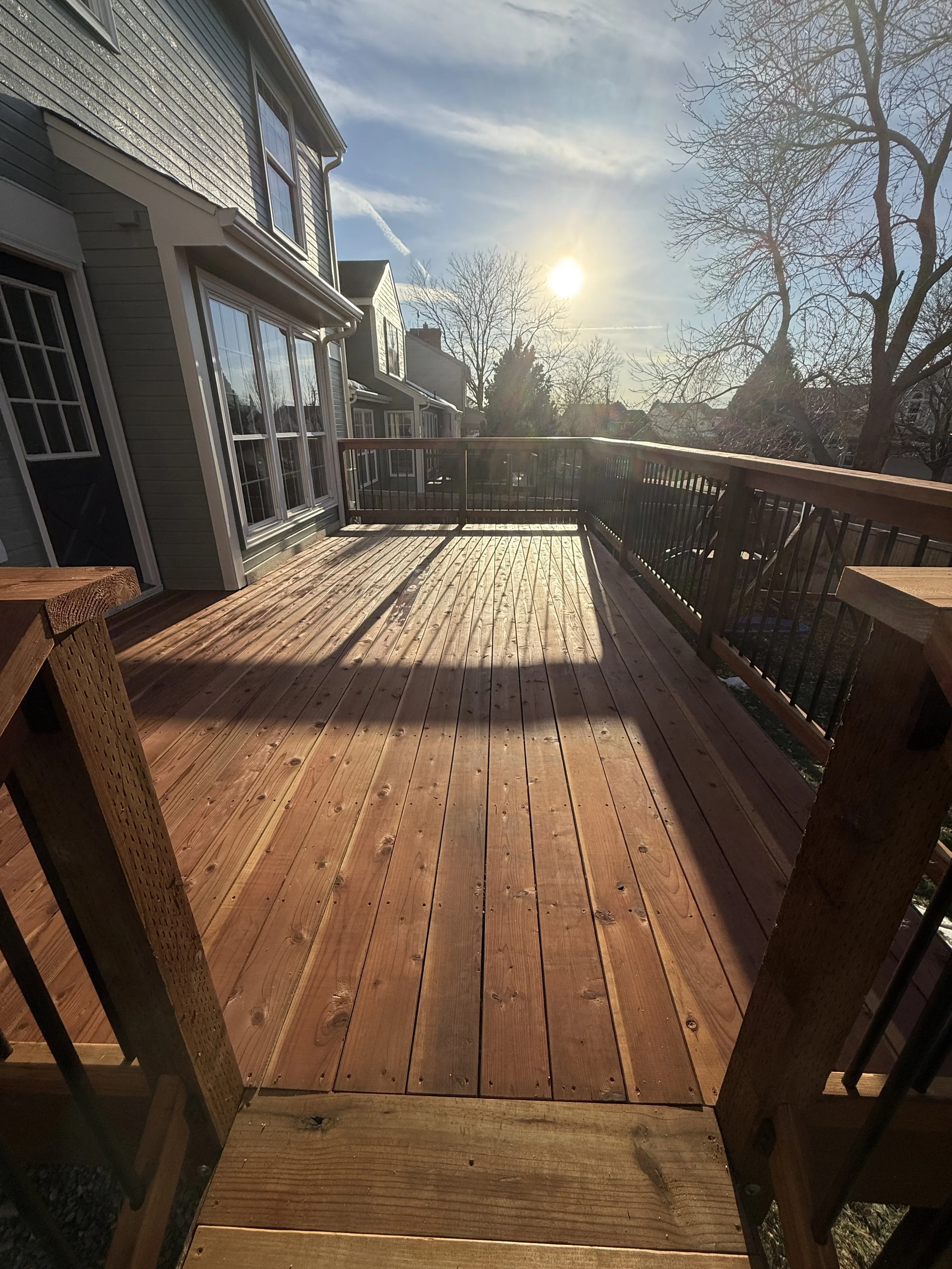 Redwood Decking, Highlands Ranch Colorado, wood railing, black metal balusters, cedar tone stain