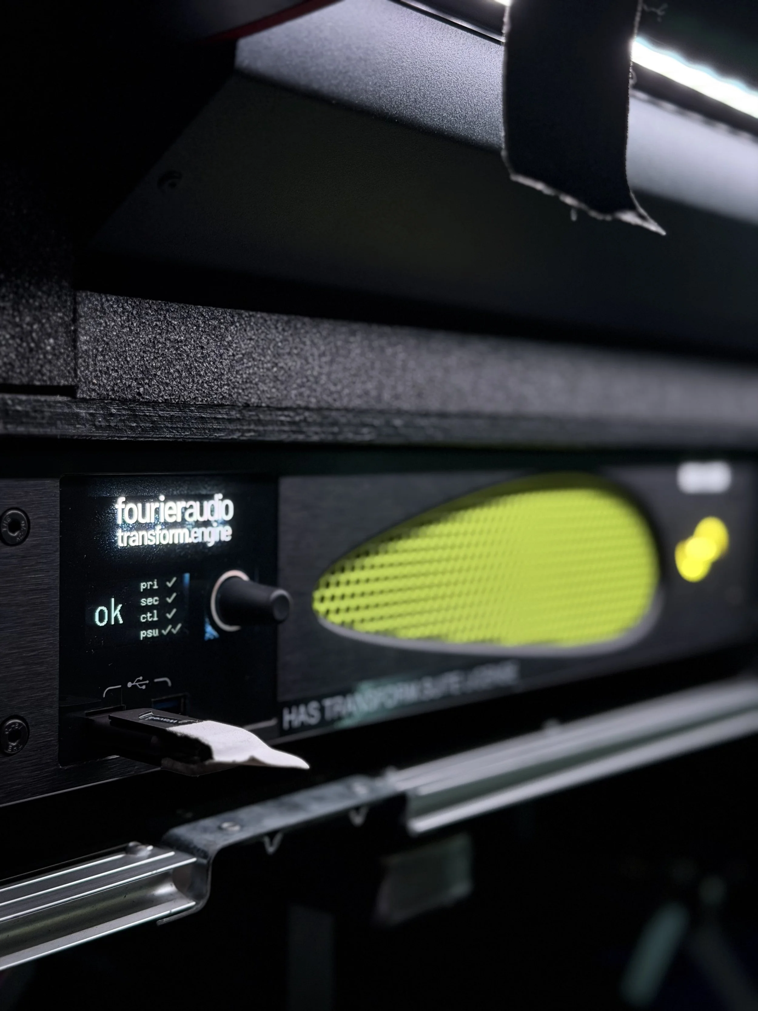 Close-up of a Fourier Audio Transform Engine processor with a small LCD display showing 'ok', and a USB stick plugged into it.