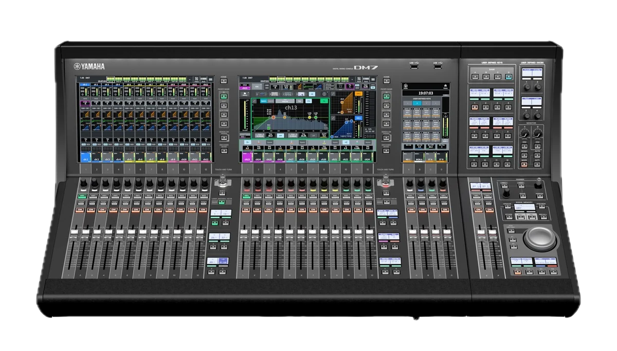 Digital audio mixing console, Yamaha DM7 model, with various faders, knobs, buttons, and a central touchscreen display.