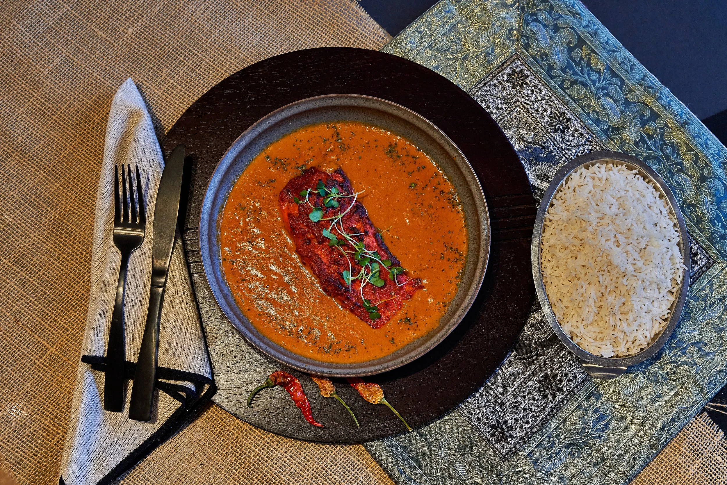Salmon Tikka Masala served with steamed basmati rice