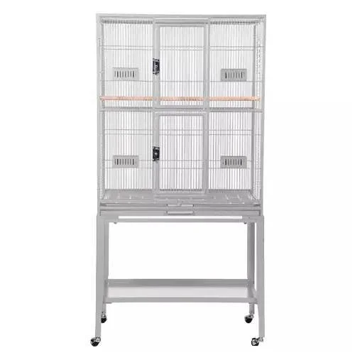 A large, white birdcage with two levels, metal bars, and a wooden perch inside, mounted on a wheeled stand.