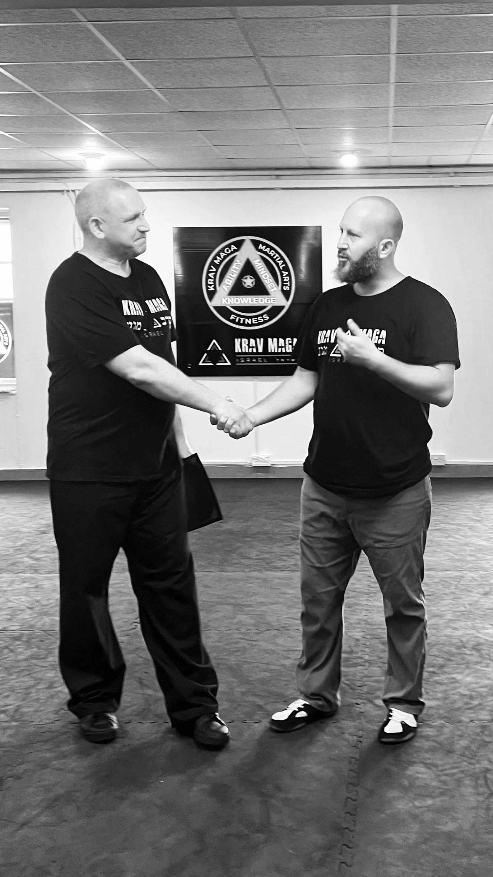 Ron Engleman awarding Kenny his Instructor's certificate