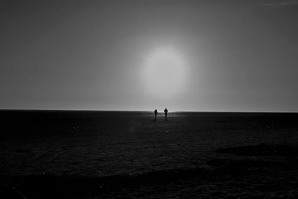 northwest coast sun silhouettes vast beach ine art photography by ManChingKC