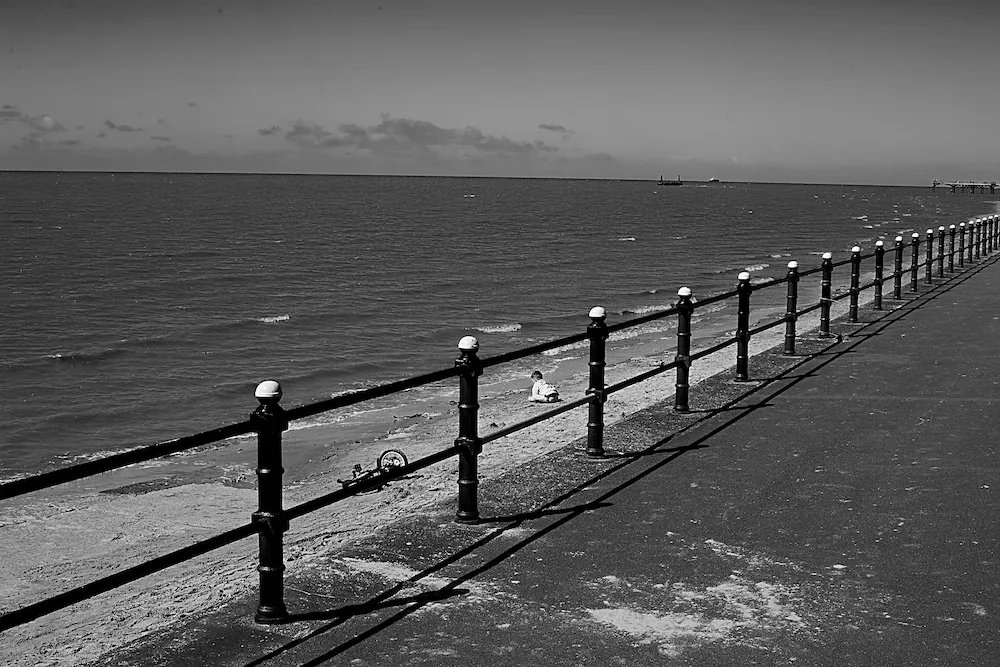 northwest coast boy in promenade railing sea view lancashire art photography by ManChingKC