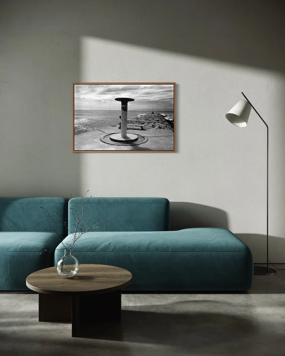 a-man-sat-on-a-stone-bench-on-embankment-wall-art.webp