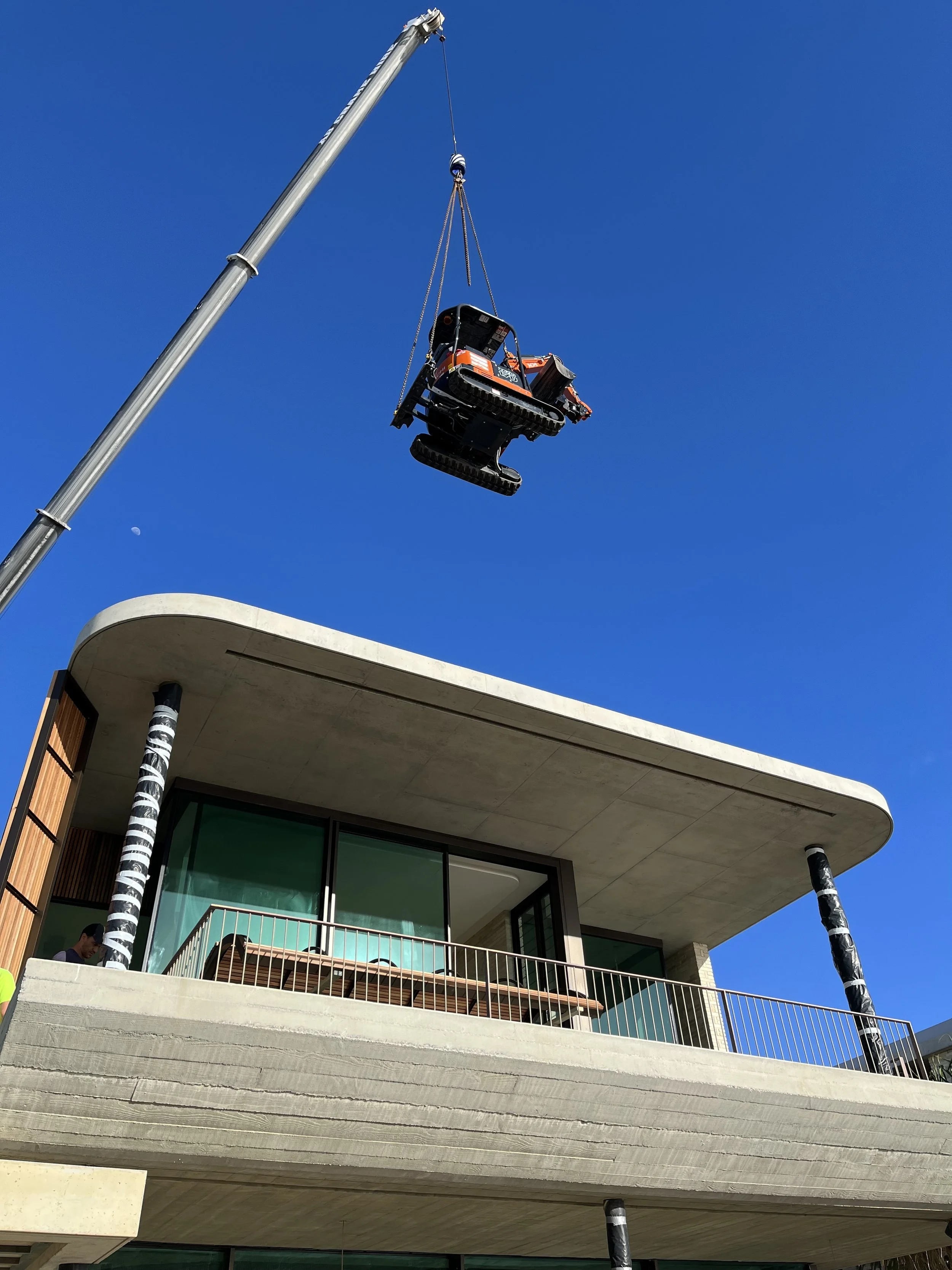 MC Diggers: 2 tone digger craned in on-site, Mermaid Beach, Gold Coast.