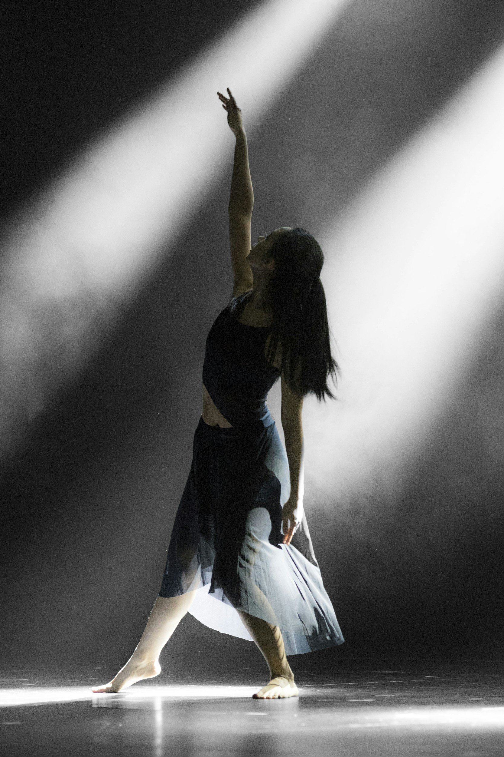 A dancer reaching up to the ceiling