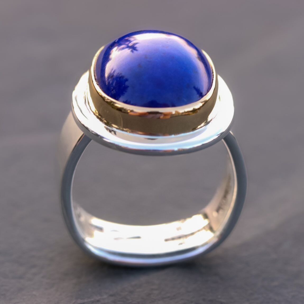 Lapis lazuli set in 22k gold and silver. The Egyptians called it the stone of heaven. Five thousand years later nothing has changed. That blue is simply what the earth made. Hand-forged band, built to be worn for decades. Refined simplicity, nothing 