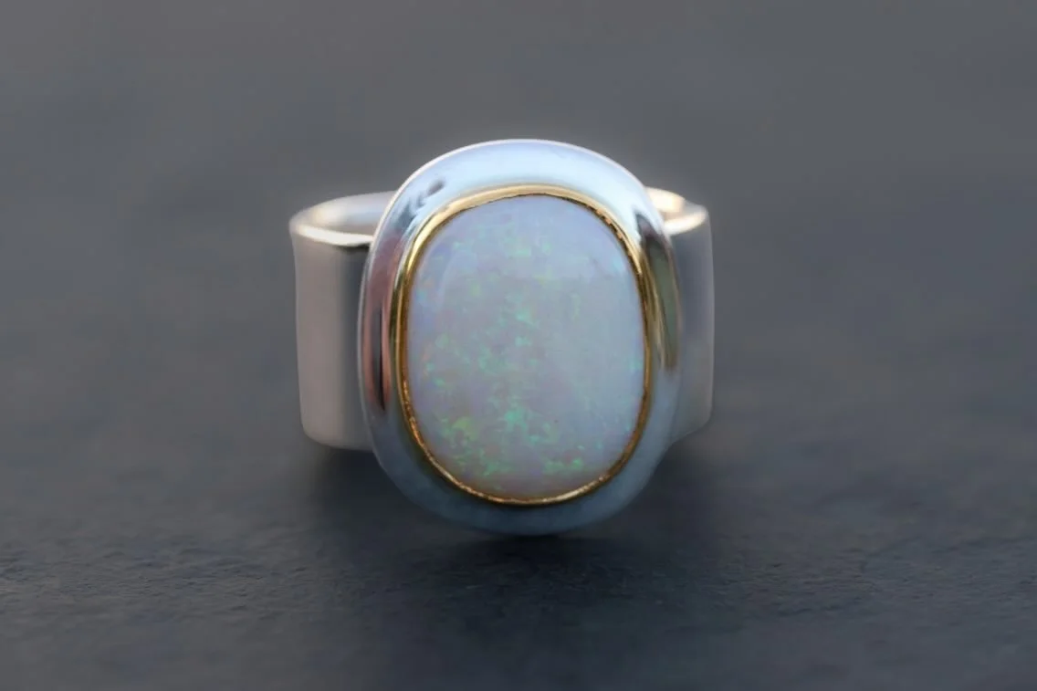 We cut this Australian opal from some old rough and set it in hand-forged silver and 22k gold. It came out well, we used to cut and set lots of opal classic such as these but the opal is hard to find these days so it&rsquo;s a rare treat. 

Available