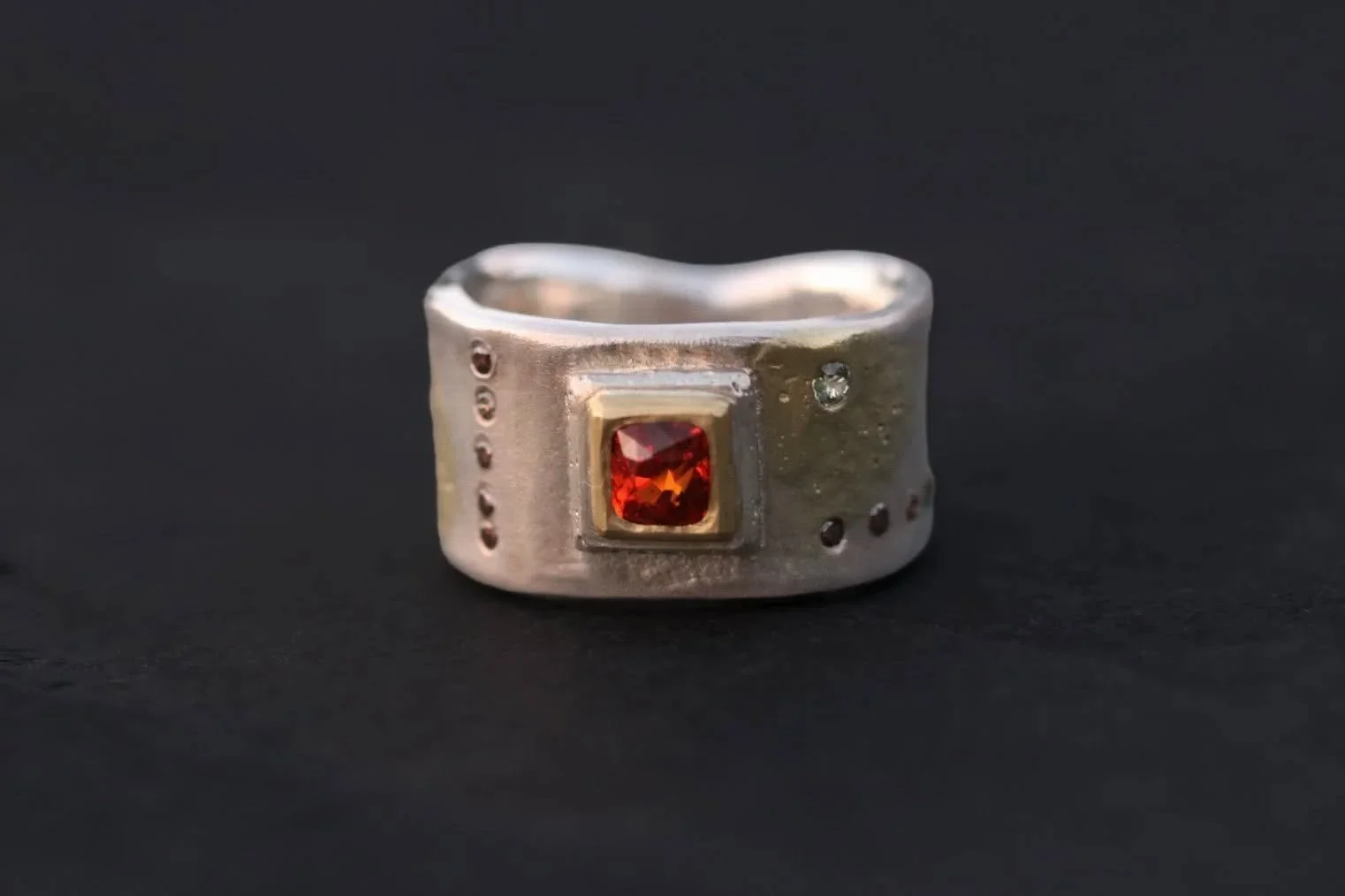 Garnet, Diamonds, &amp; Sapphires Forged Cigar Band.
22k gold.
One of a kind.

#bigsurgoldsmiths #highkaratgold #oneofakindjewelry #garnet #handforged
