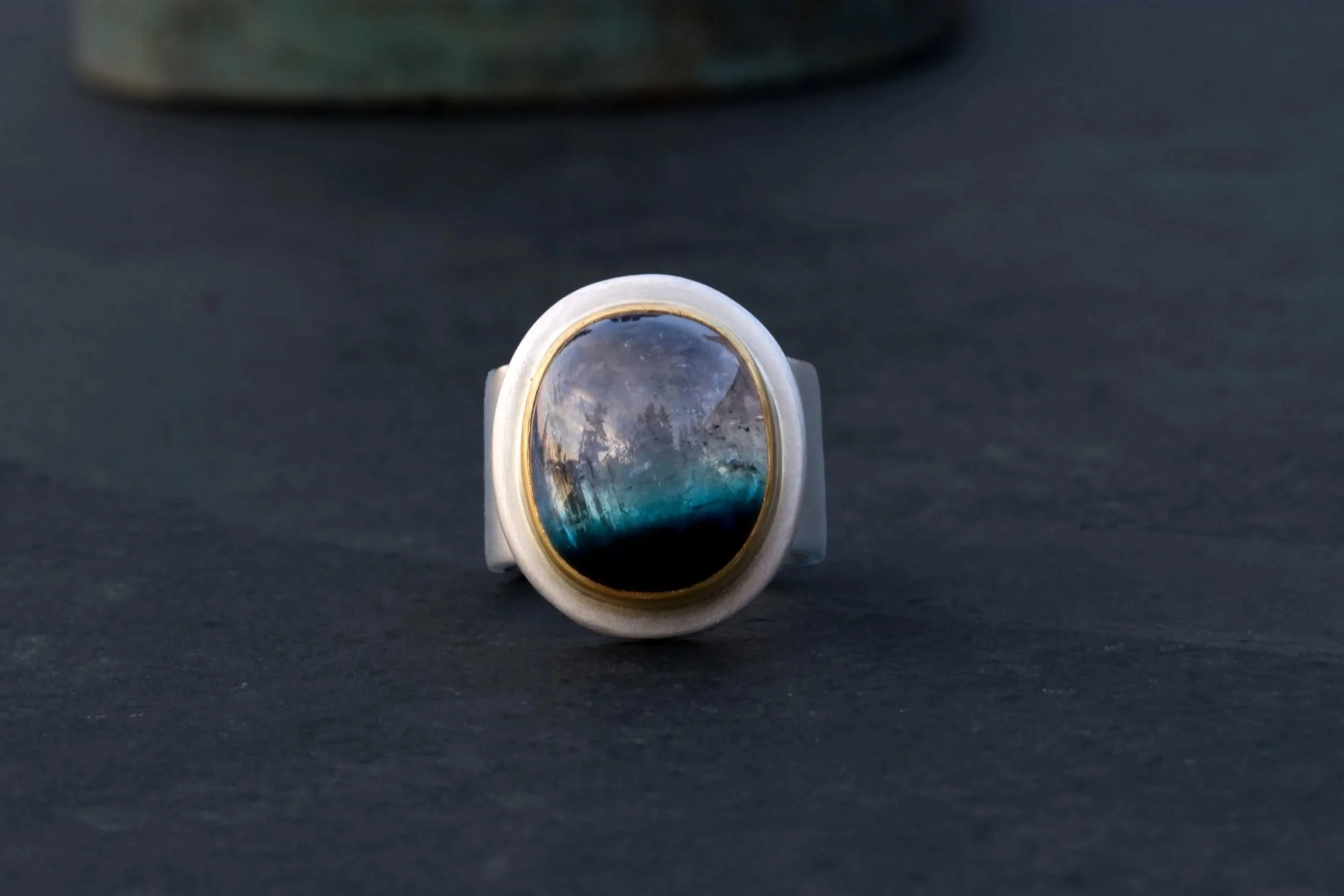 Bi-Color Tourmaline Big Sur Classic Ring.
22k gold.
One of a kind.

#bigsurgoldsmiths #highkaratgold #oneofakindjewelry #tourmaline #handforged