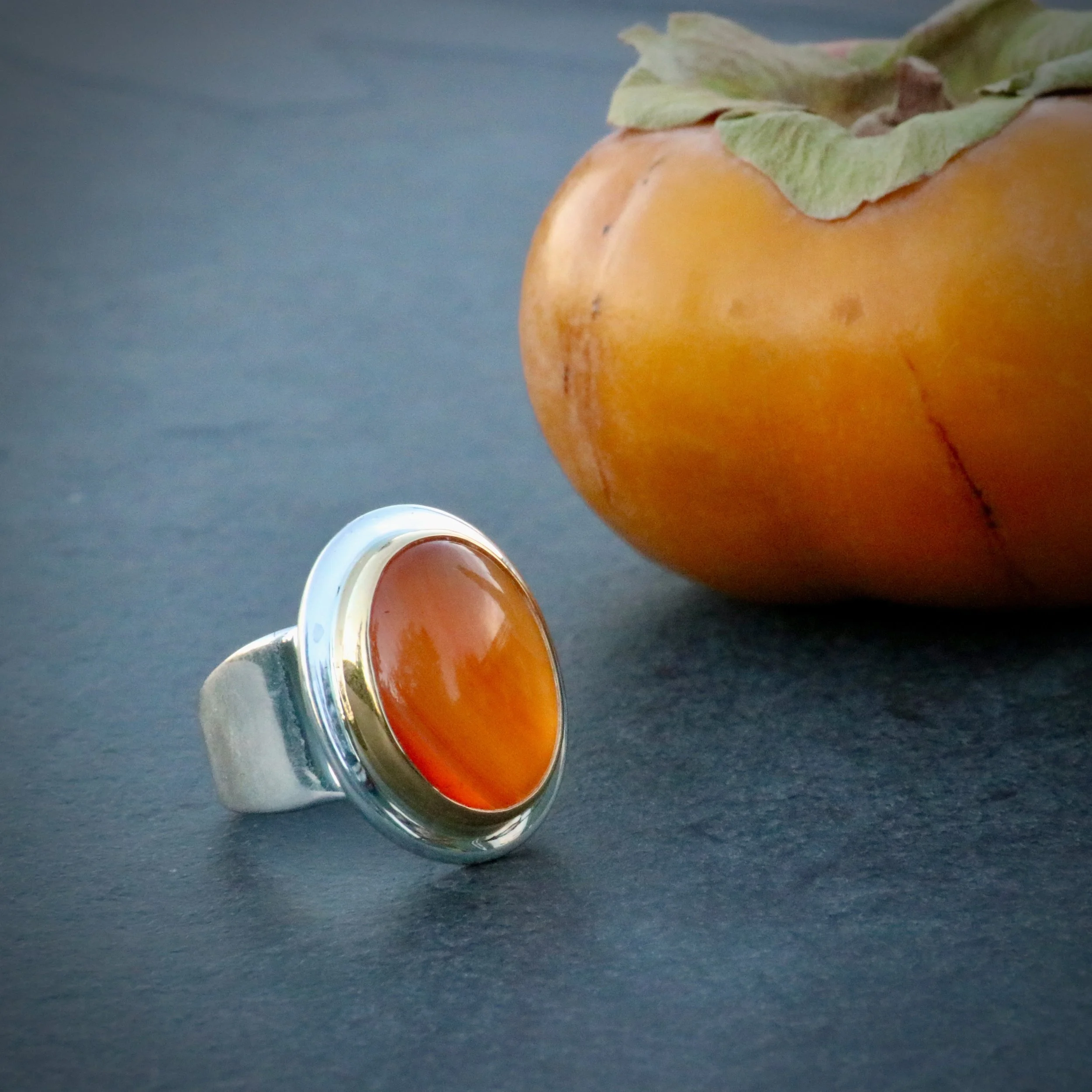 Carnelian season, 
persimmon season. 
.
CARNELIAN/ 22K GOLD/ STERLING SILVER
.
#finecraft 
#studiojewelry 
#ringgoals 
#carriearmstrongdesign 
#bigsurgoldsmiths