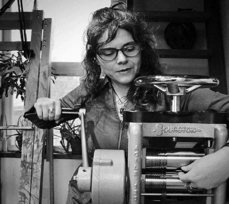Carrie Armstrong goldsmith milling wire by hand, Big Sur Goldsmiths studio, Pacific Northwest