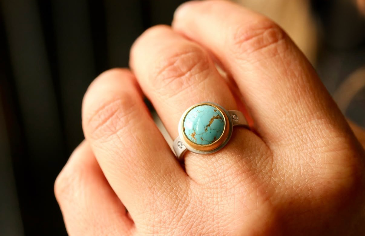 Carrie Armstrong's turquoise gemstone ring set in a silver band.