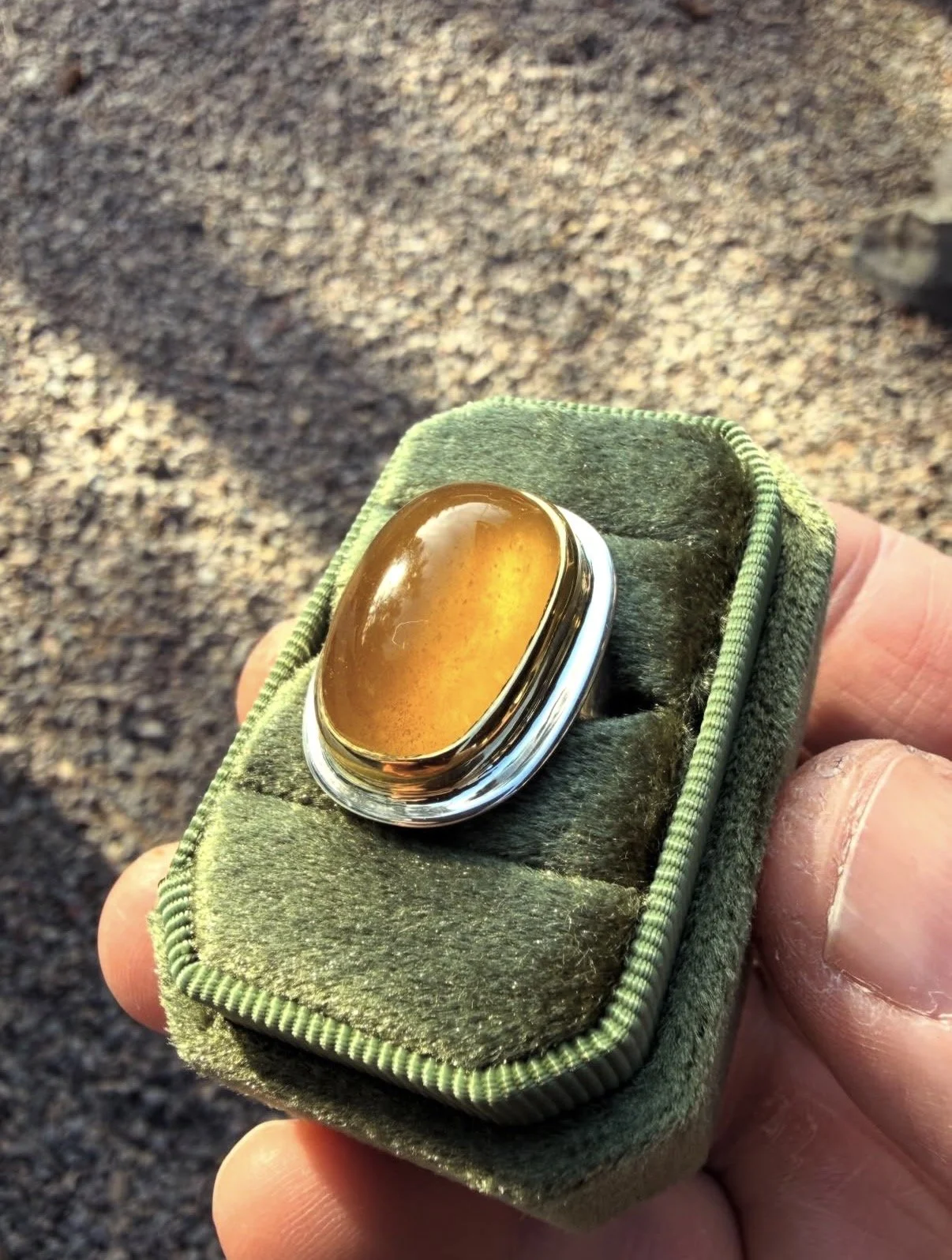 Ali Lee's large amber-colored gemstone ring