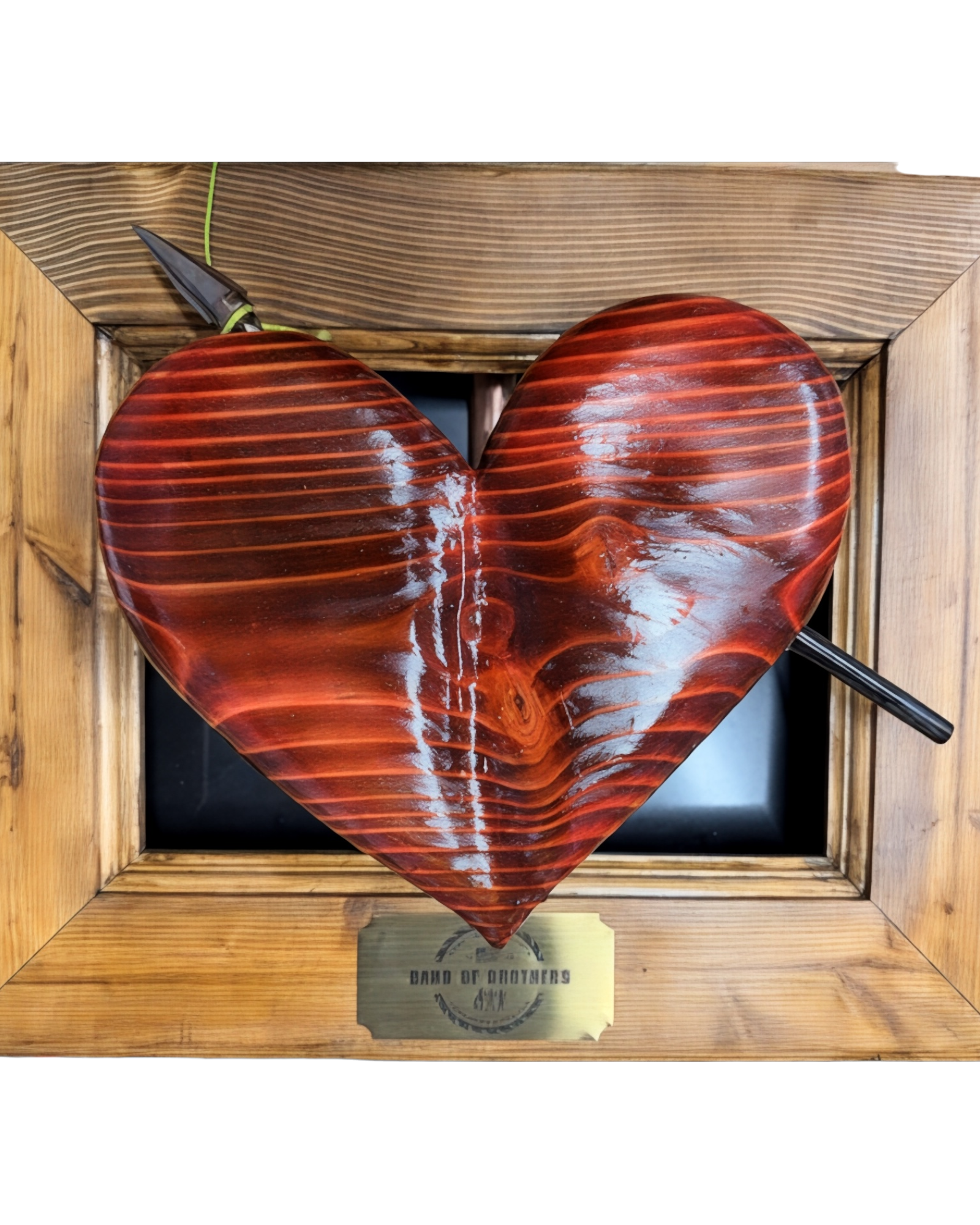 Hand Carved Wood Heart with Arrow Framed.png