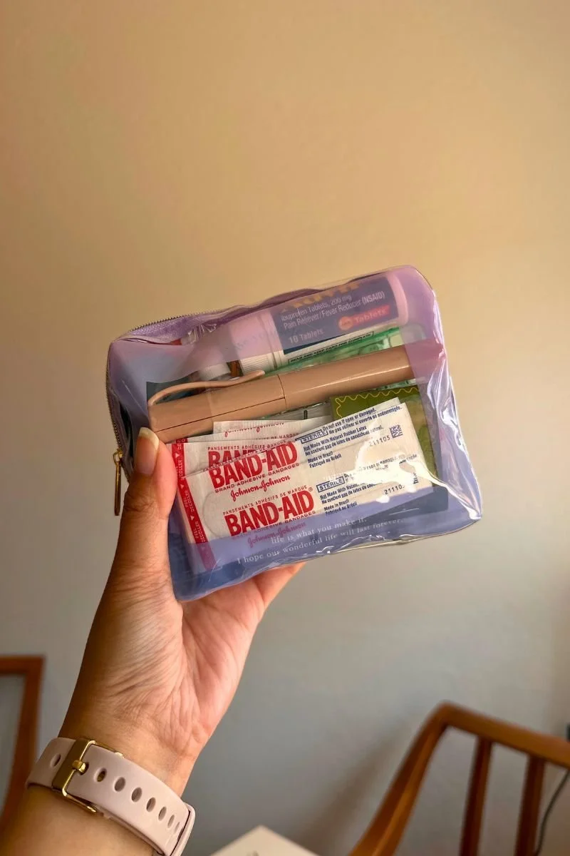 Wedding coordinator emergency kit with Band-Aids, ibuprofen, and first aid essentials — day-of coordination by reverie&