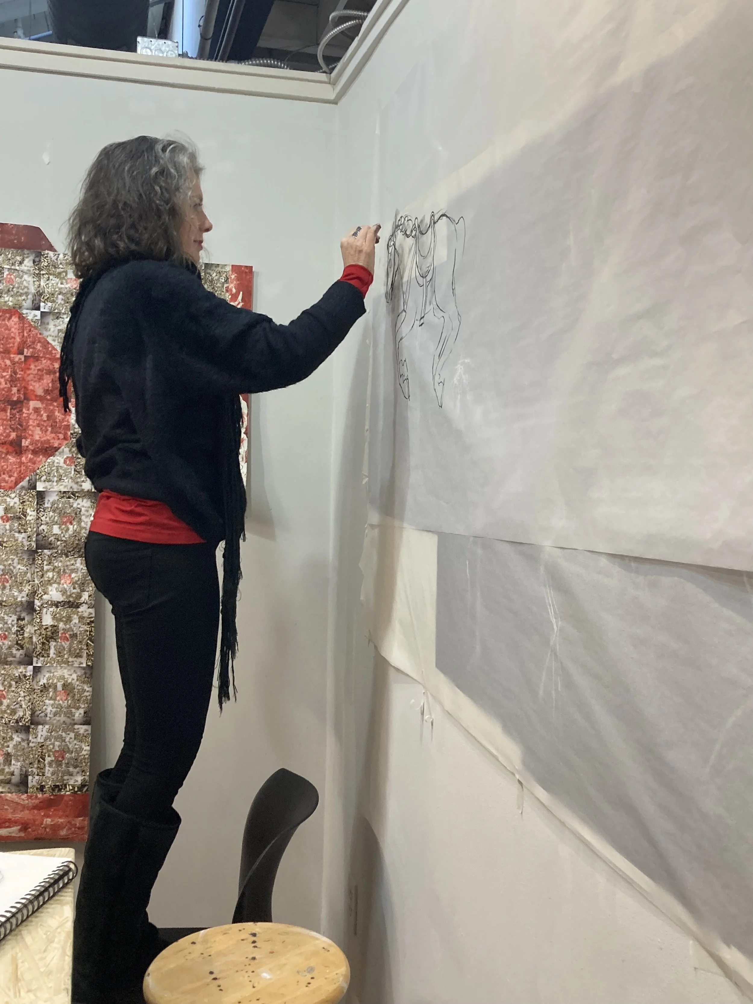 Jenny drawing another layer in the studio