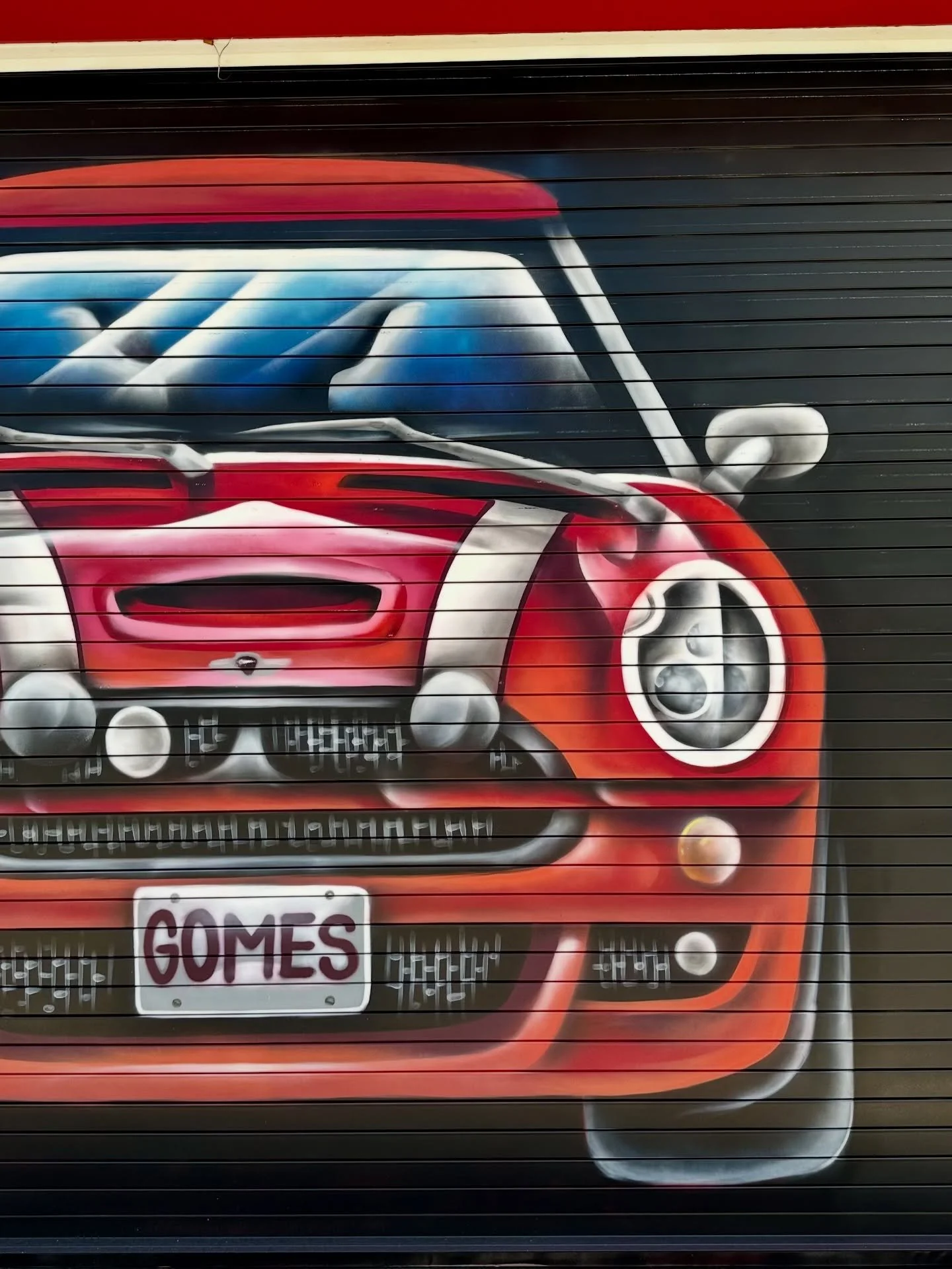 A Mini Cooper&hellip; but not where you&rsquo;d expect it 

Right on the garage doors, turning a passing moment into something you actually stop for.

Clean lines. Bold placement. No rules.

Next to our Looney Tunes mural, the contrast hits hard. Big