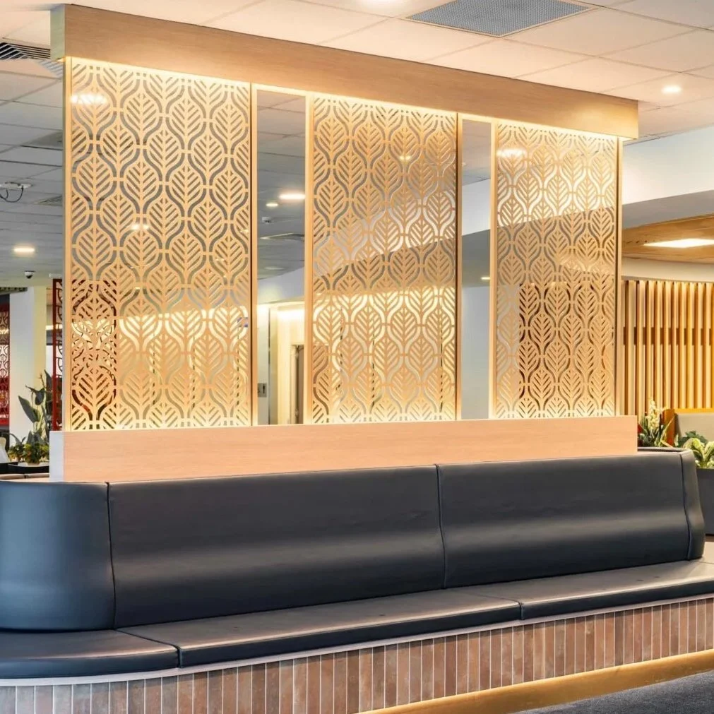 Decorative partition laser cut screens. Custom artwork for commercial fit outs. Laser cut aluminium screens. Eden Leaf design. Gold decorative panels for room dividers. Interior design inspiration for commercial projects. Design by Deborah VanDieren