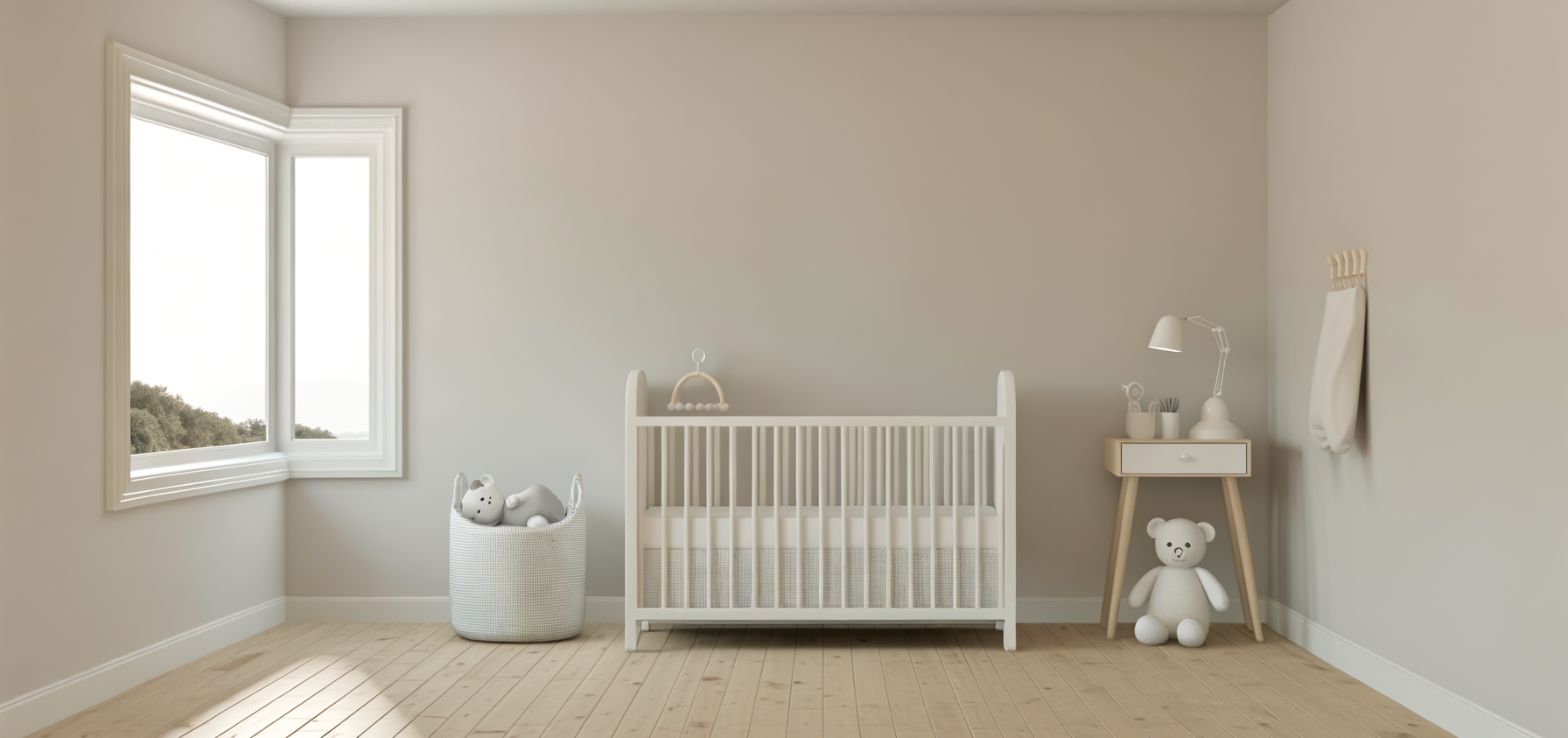 Minimalist baby nursery with a white crib, a laundry basket with plush toys, a small wooden changing table with a lamp and toddler essentials, a large plush teddy bear on the floor, and a window with a scenic view.