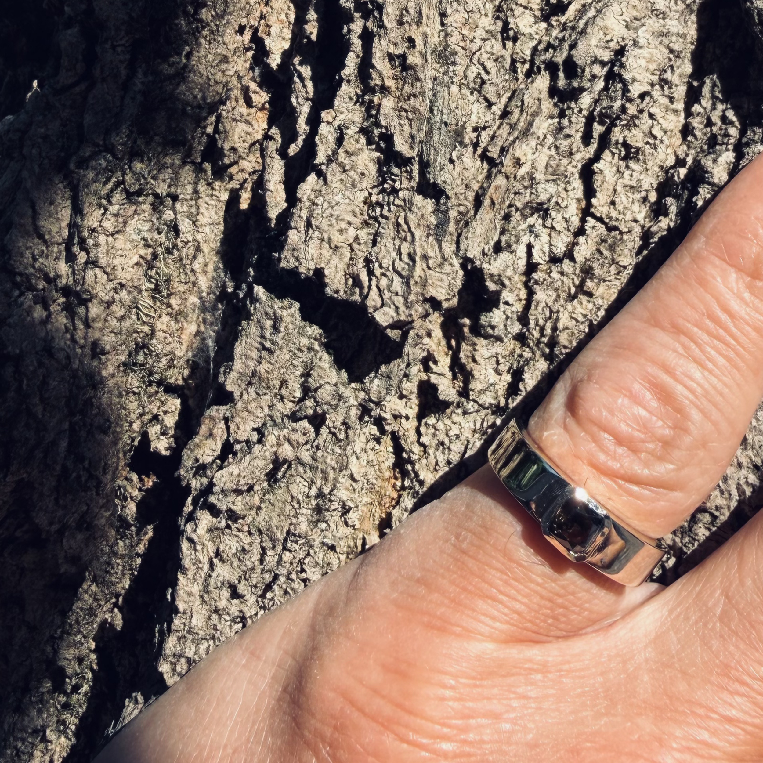 Close-up of ØRIGEN men’s pinky ring with natural Fancy Deep Brown Yellow diamond