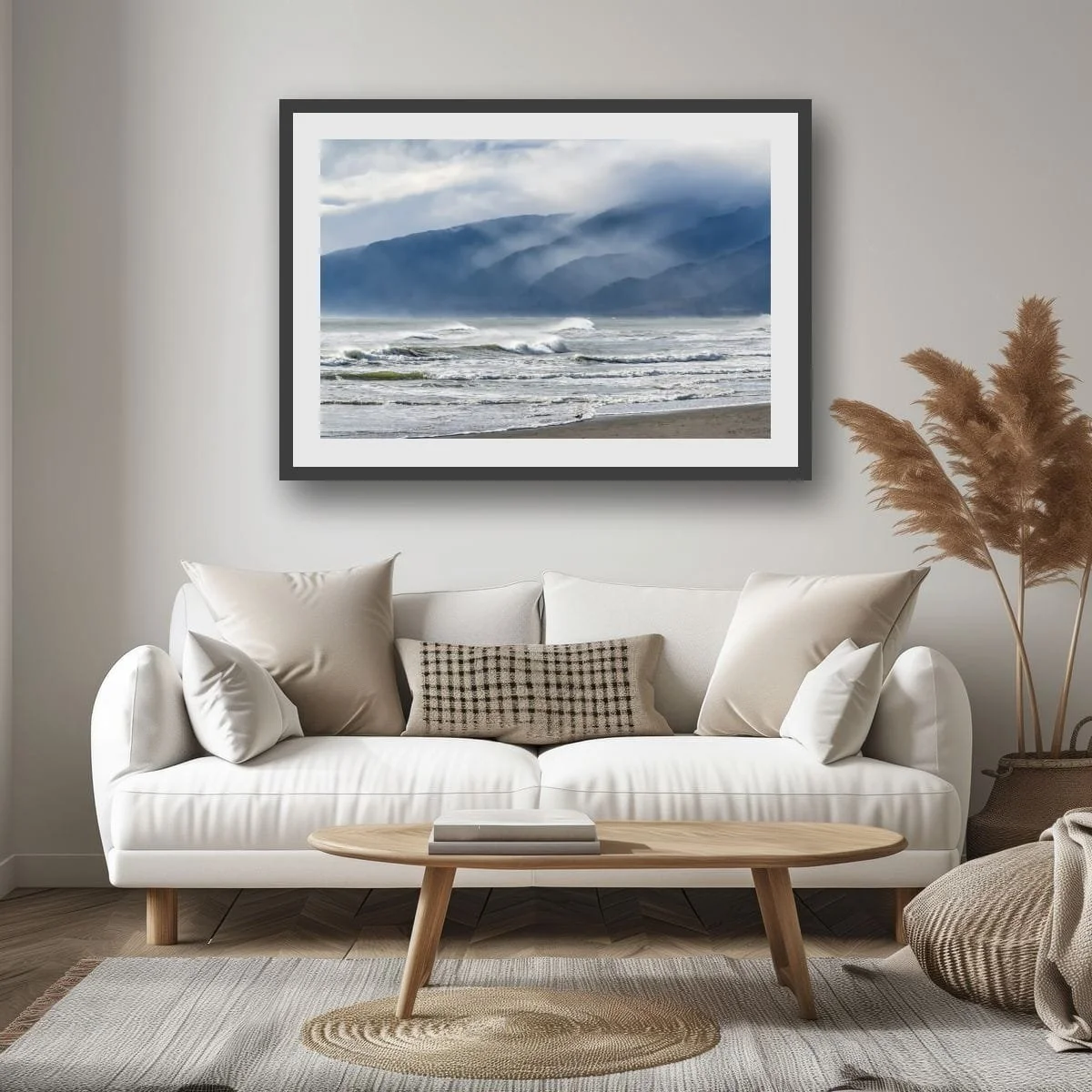 Waves breaking beneath mist-covered mountain ranges on the West Coast of New Zealand.