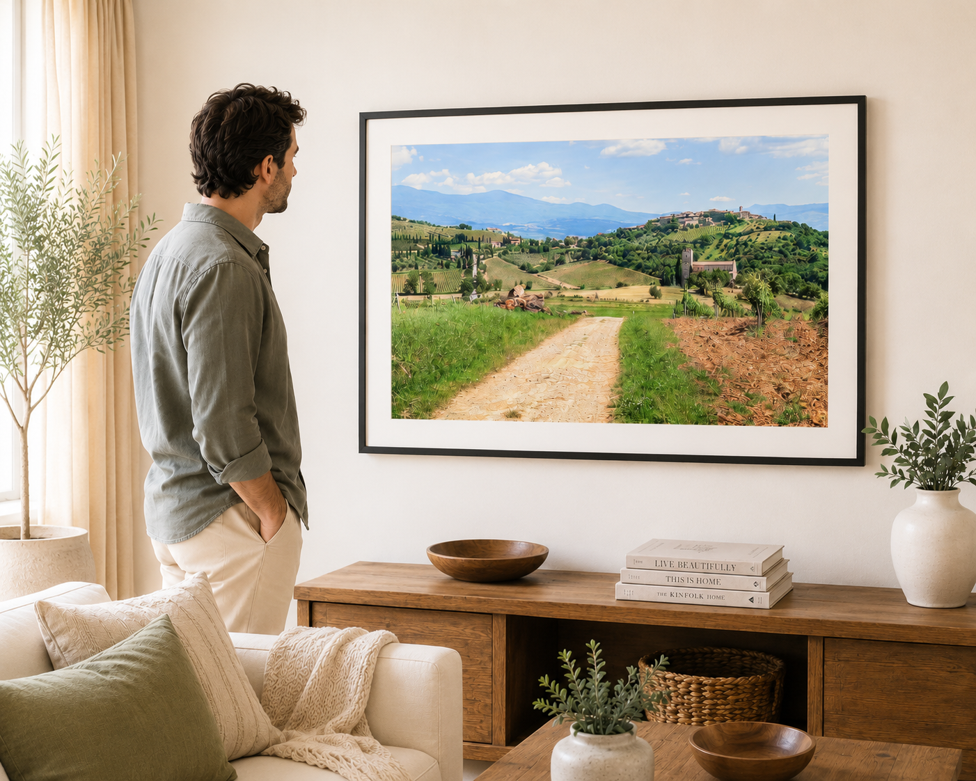 Rolling Tuscan hills with vineyards and historic hilltop village.