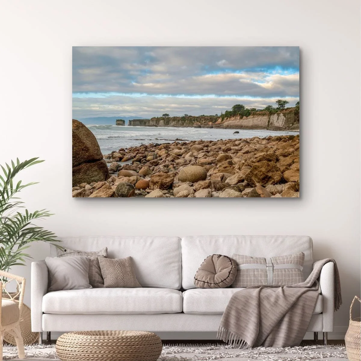 Rocky shoreline leading to limestone cliffs on New Zealand's West Coast.