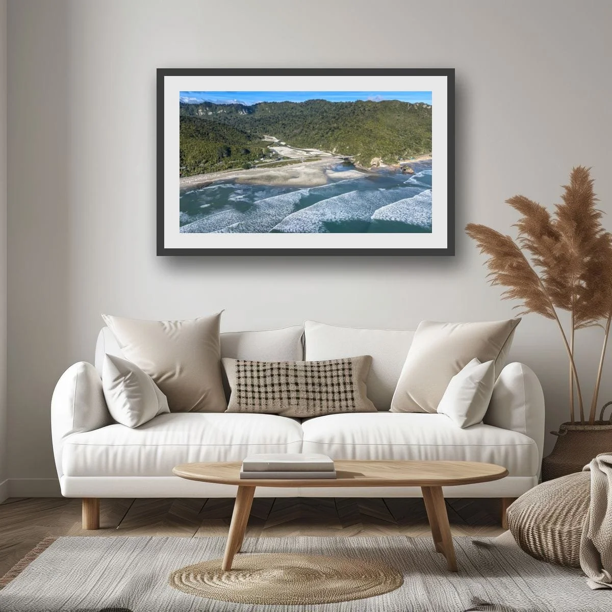 Aerial view of river mouth meeting the Tasman Sea on the West Coast.