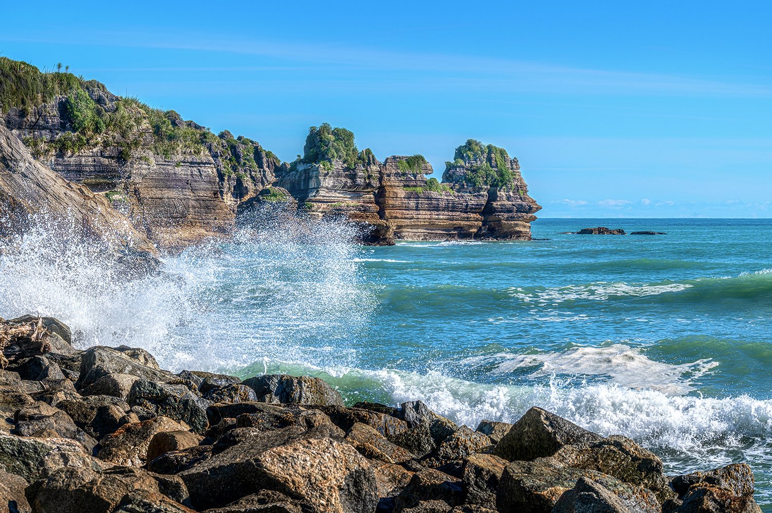 Ocean spray crashing against the Pancake Rocks at Punakaiki.