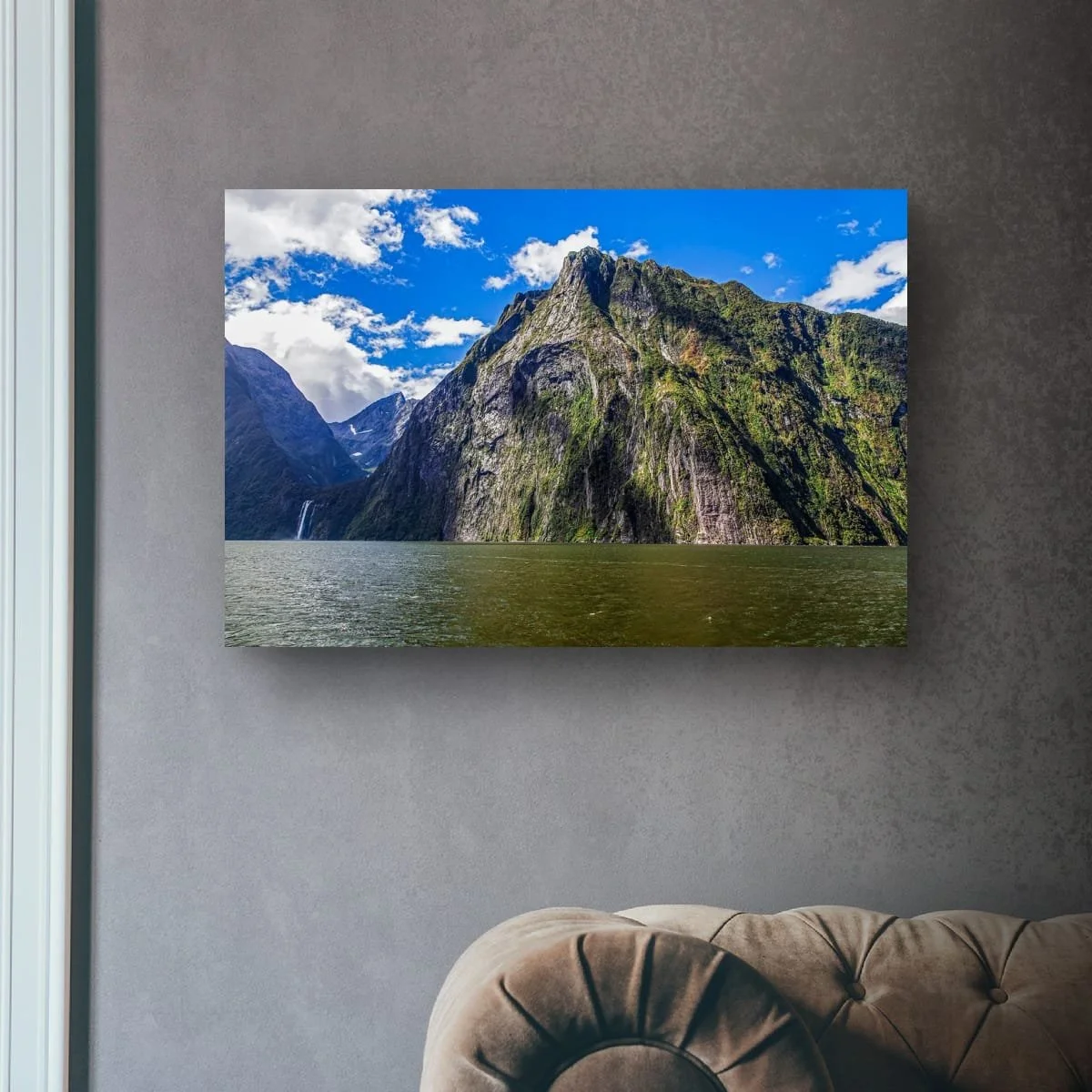 Towering cliffs and waterfalls in Milford Sound.