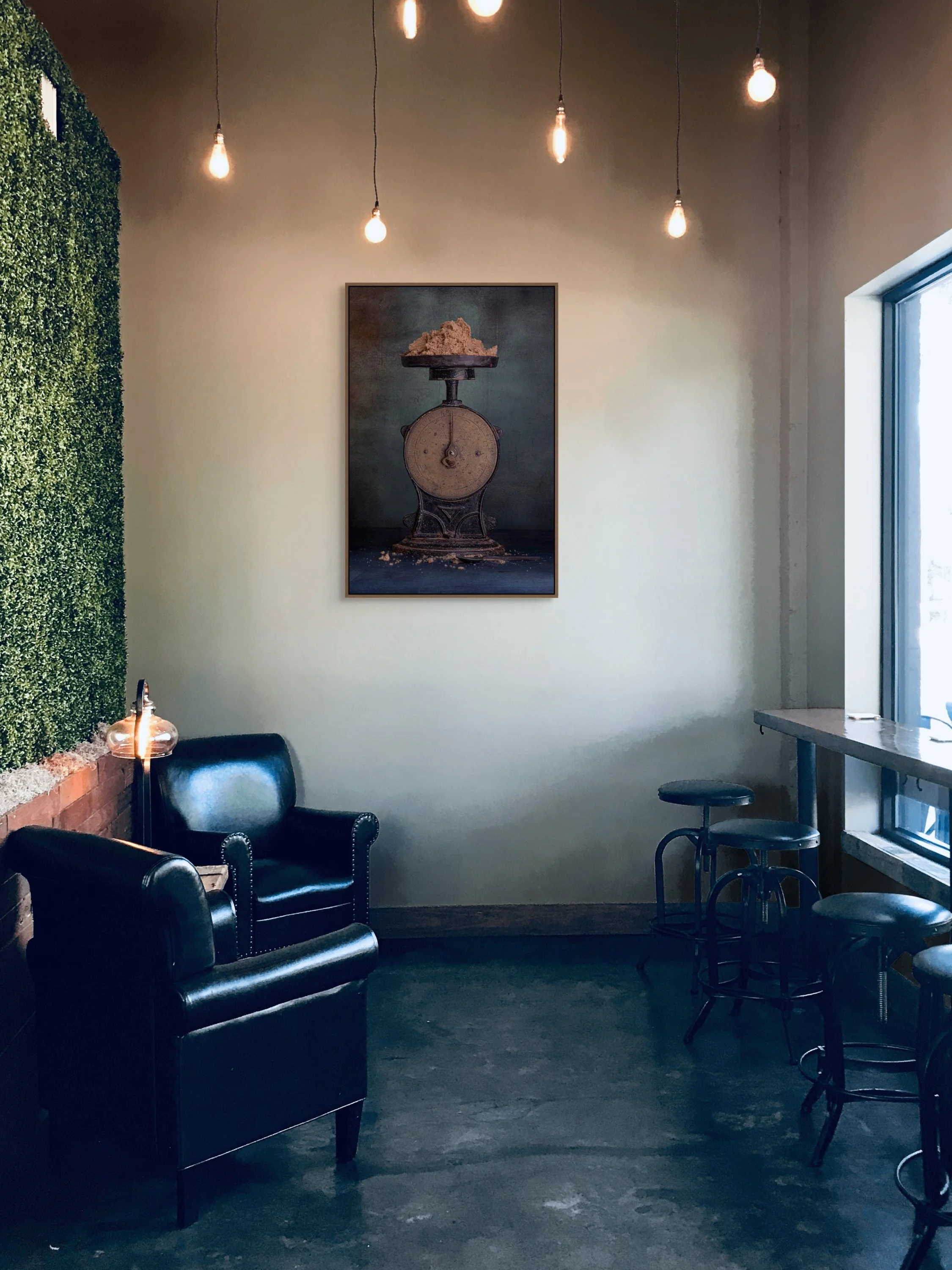 Vintage kitchen scale holding raw sugar in a moody still life photograph.