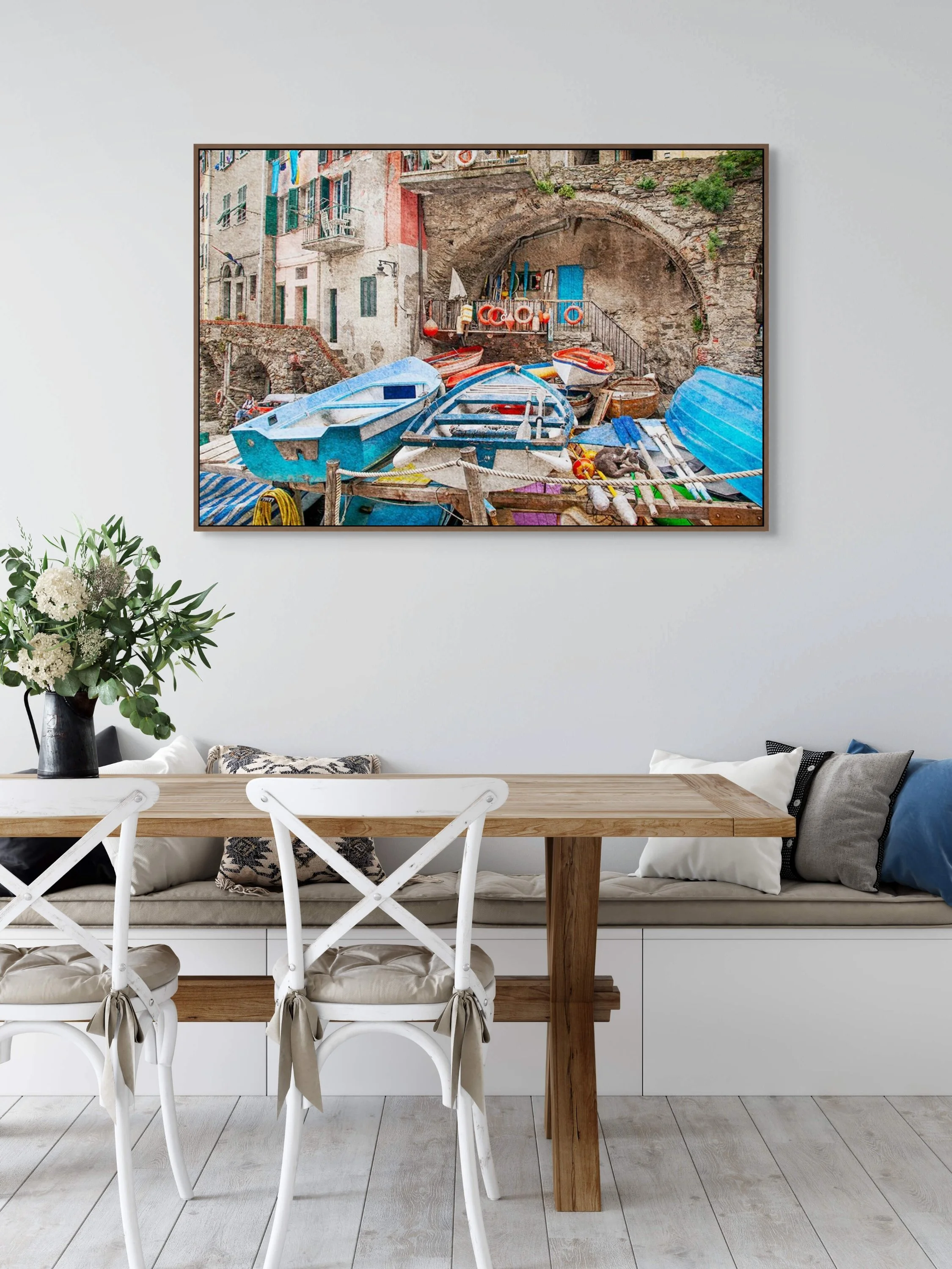 Colourful fishing boats and harbour scene in rustic seaside village.