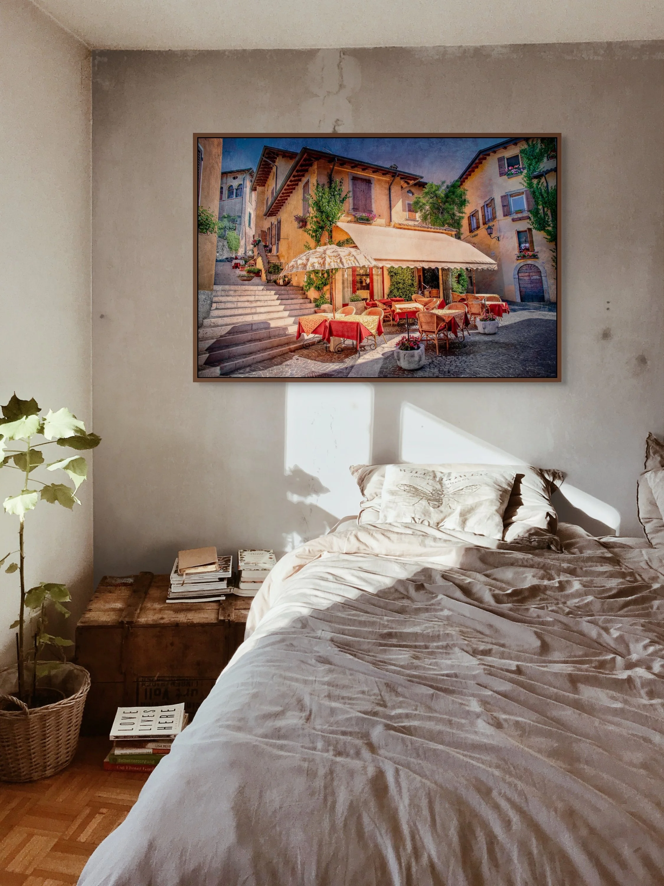 Italian street café with red tablecloths and terrace seating in a historic village.