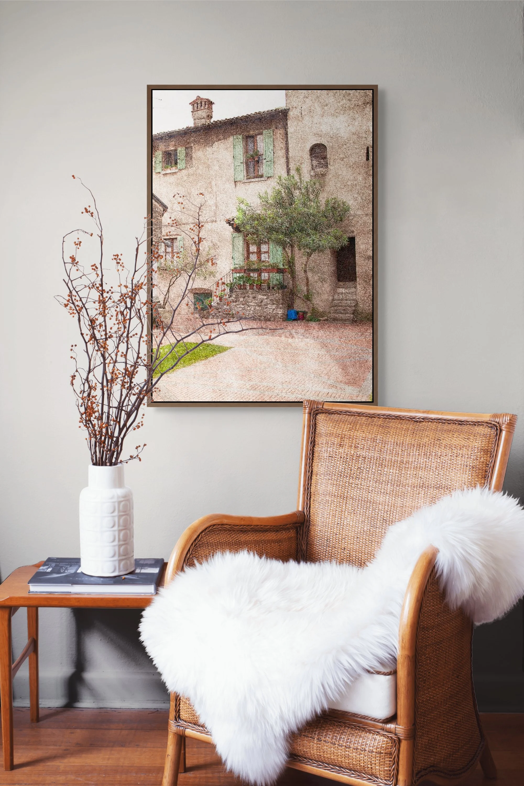 Rustic Italian village home with green shutters, courtyard and olive tree.