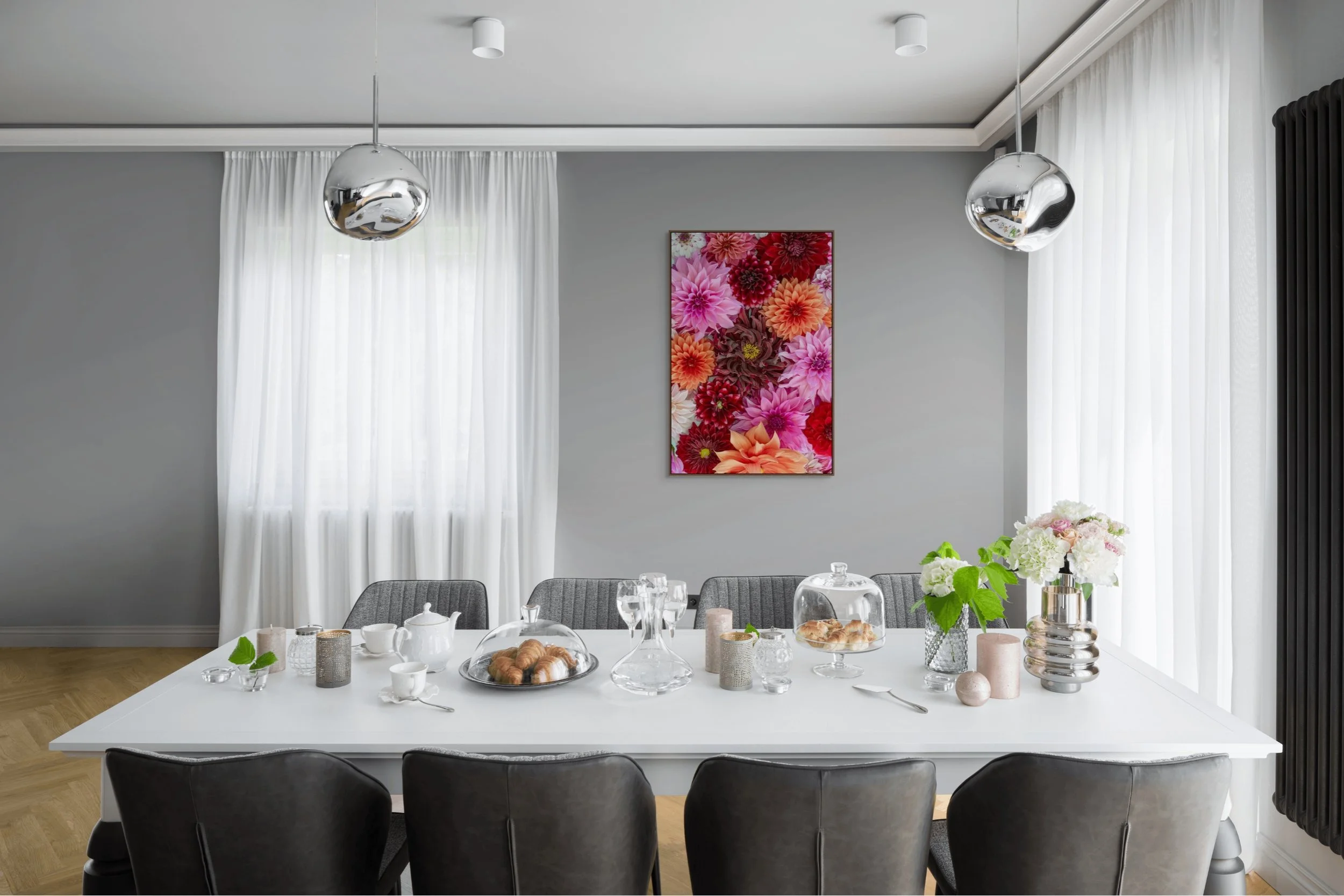 Collection of vibrant dahlia flowers in pink, red and coral tones arranged closely together.