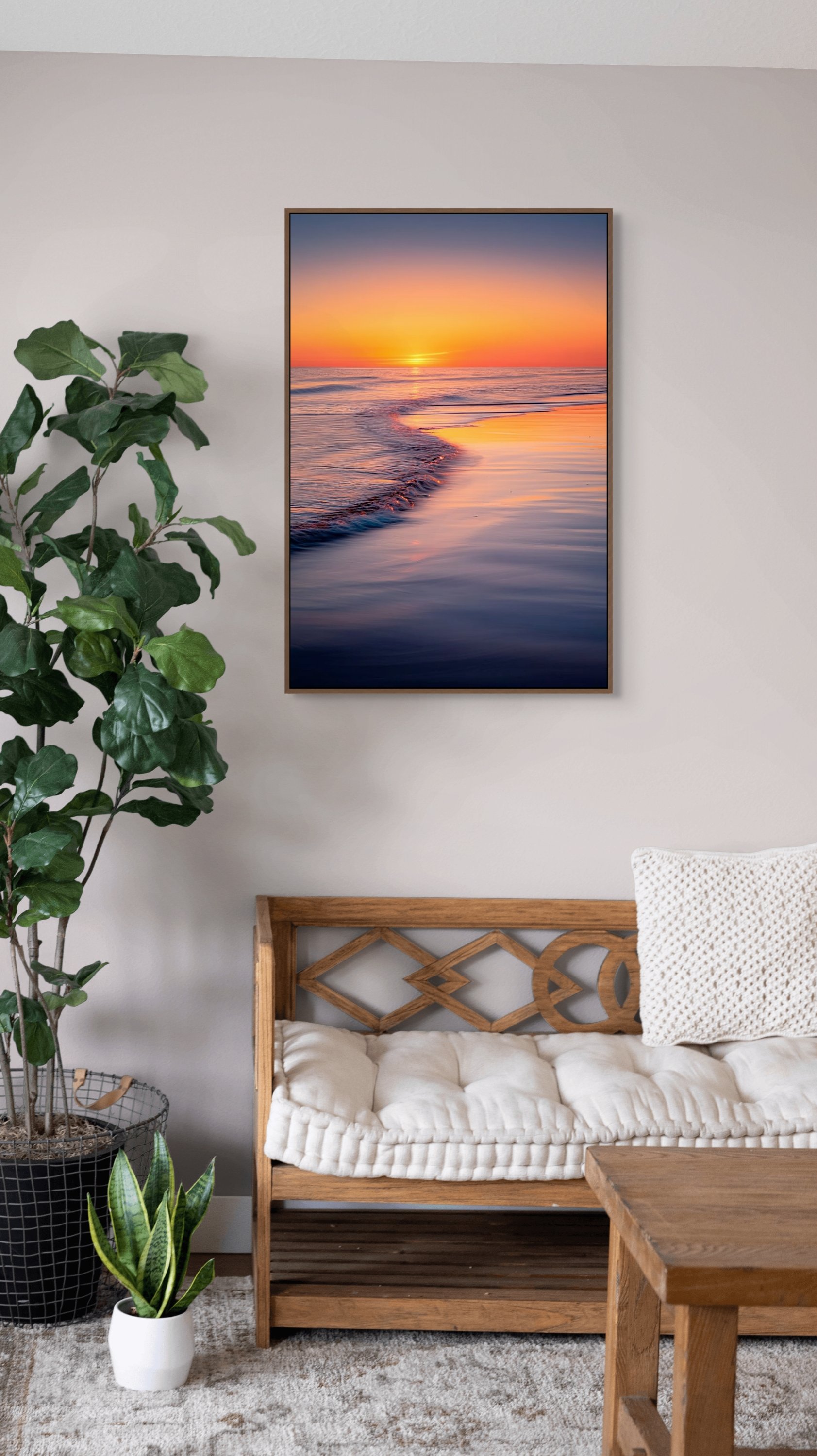 Golden sunset over ocean waves with warm reflections on wet sand.